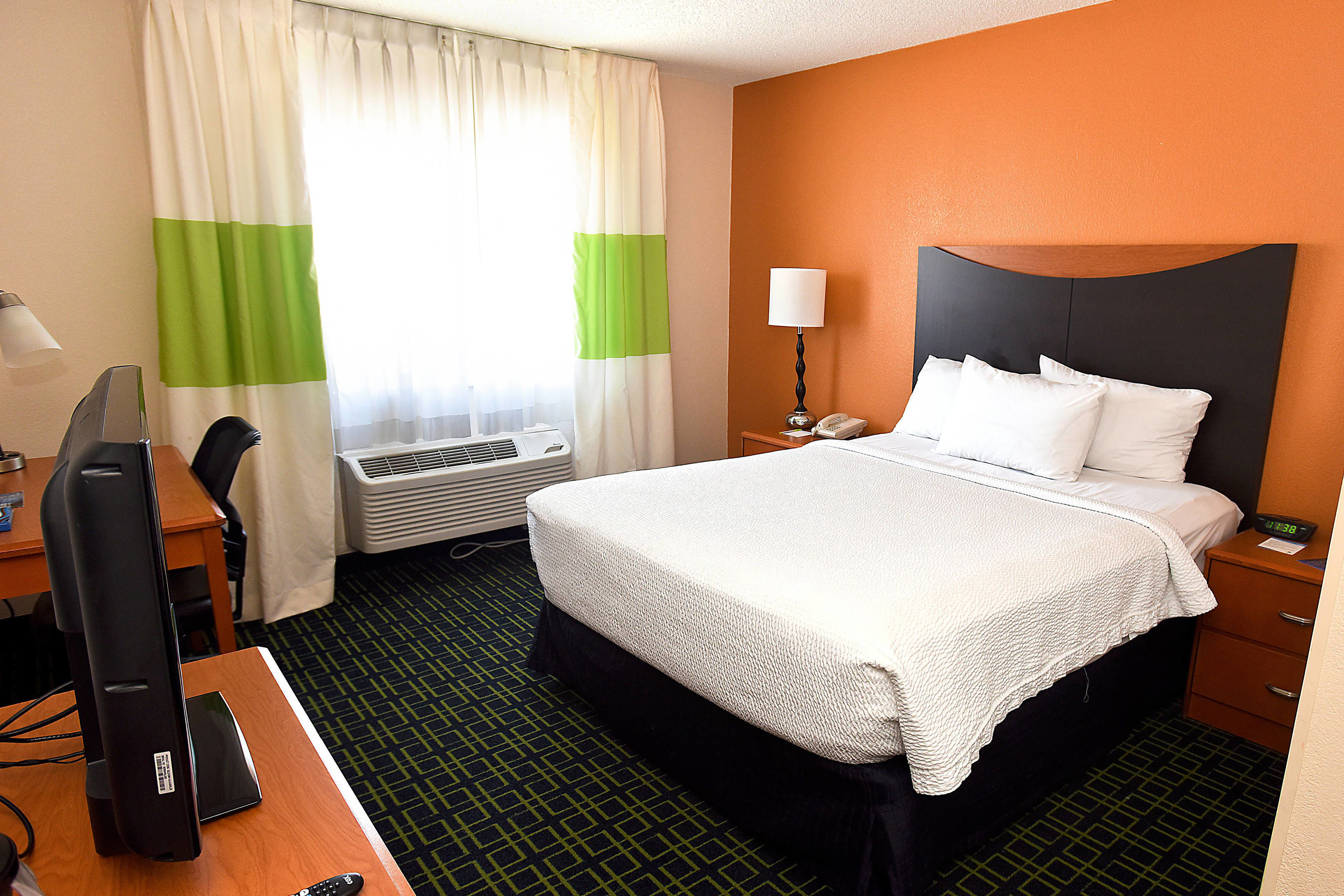 Guest room at the AmericInn by Wyndham Topeka in Topeka, Kansas