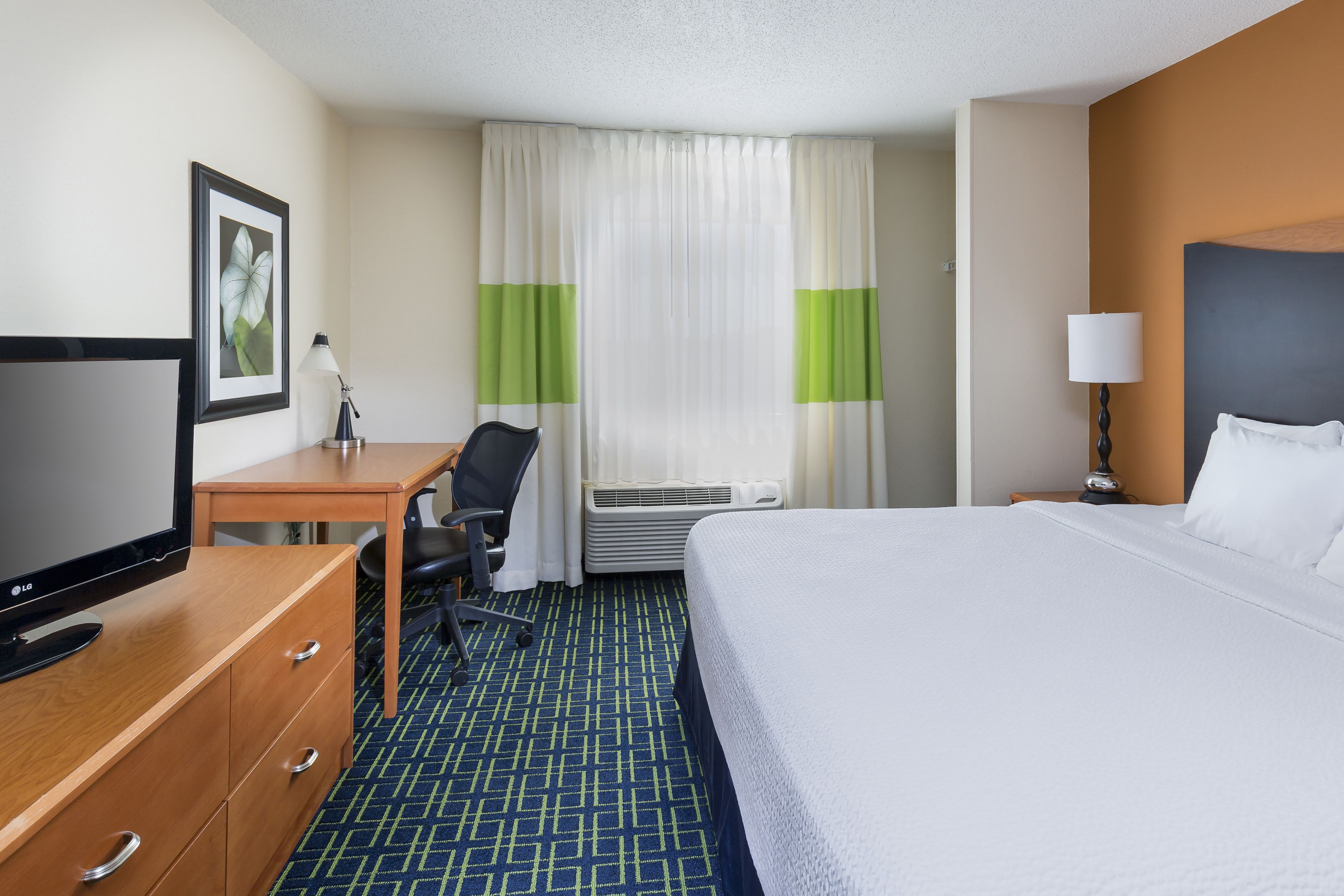 Guest room at the AmericInn by Wyndham Topeka in Topeka, Kansas