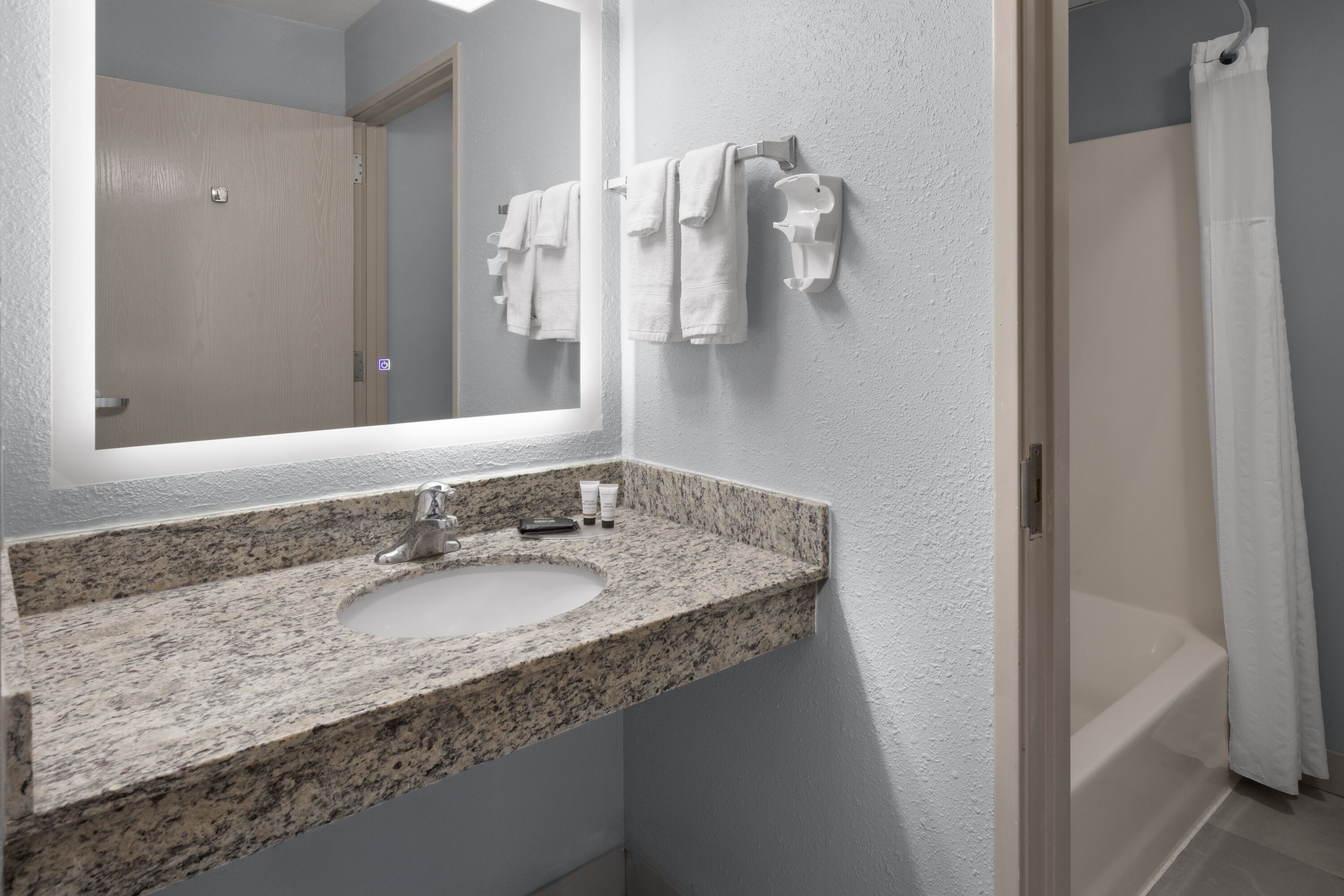 Guest room bath at the AmericInn by Wyndham Douglas/Saugatuck in Douglas, Michigan