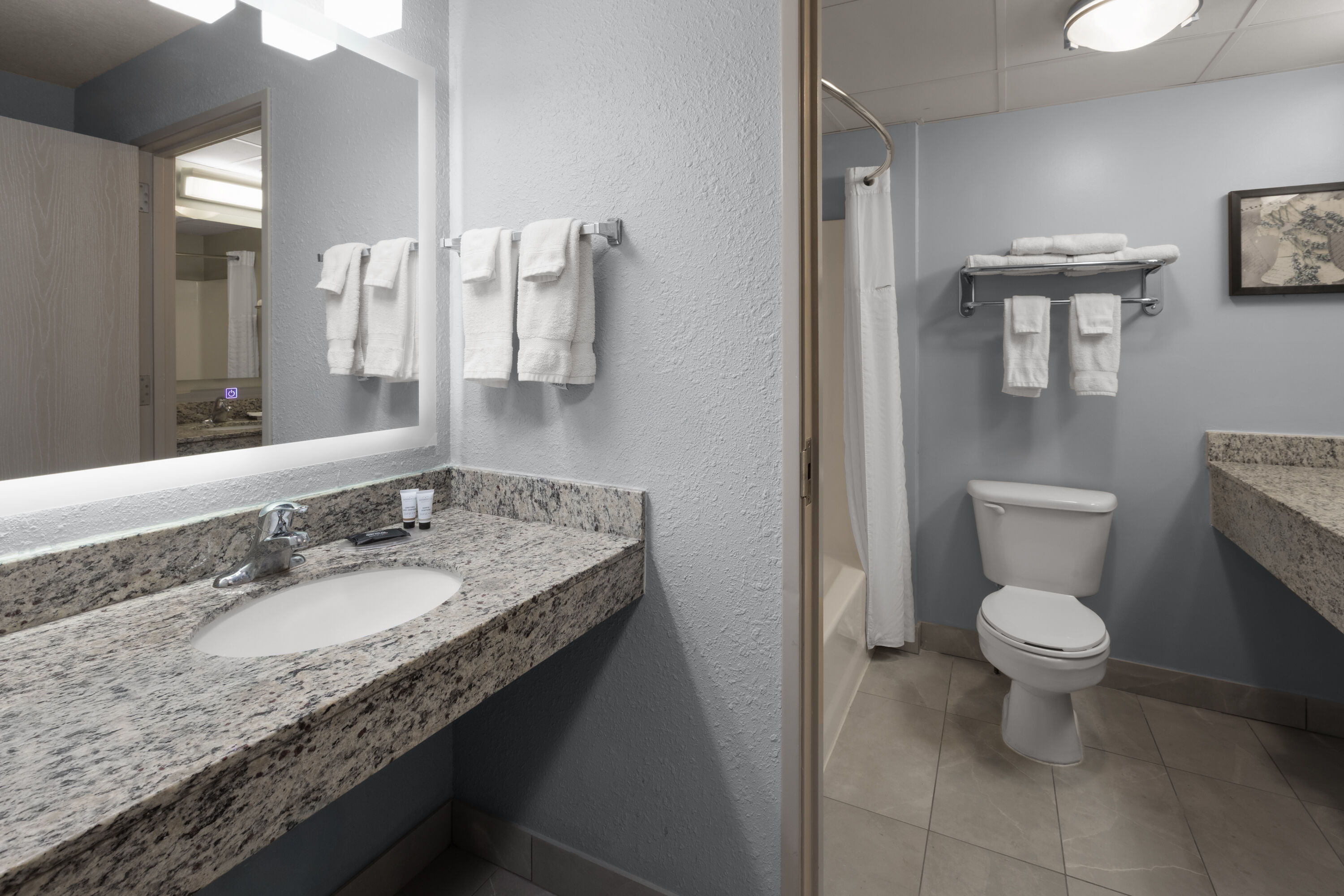 Guest room bath at the AmericInn by Wyndham Douglas/Saugatuck in Douglas, Michigan