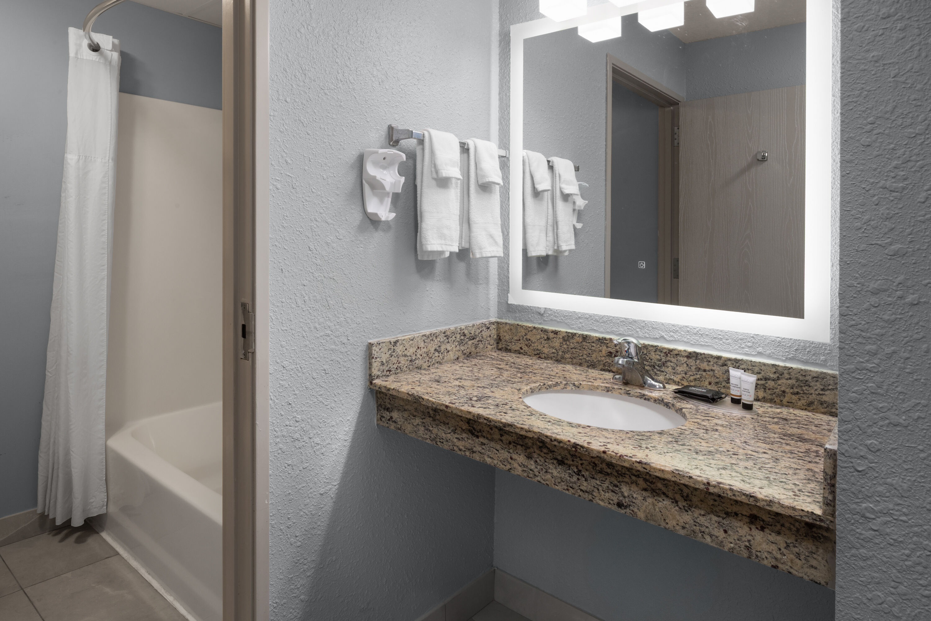 Guest room bath at the AmericInn by Wyndham Douglas/Saugatuck in Douglas, Michigan