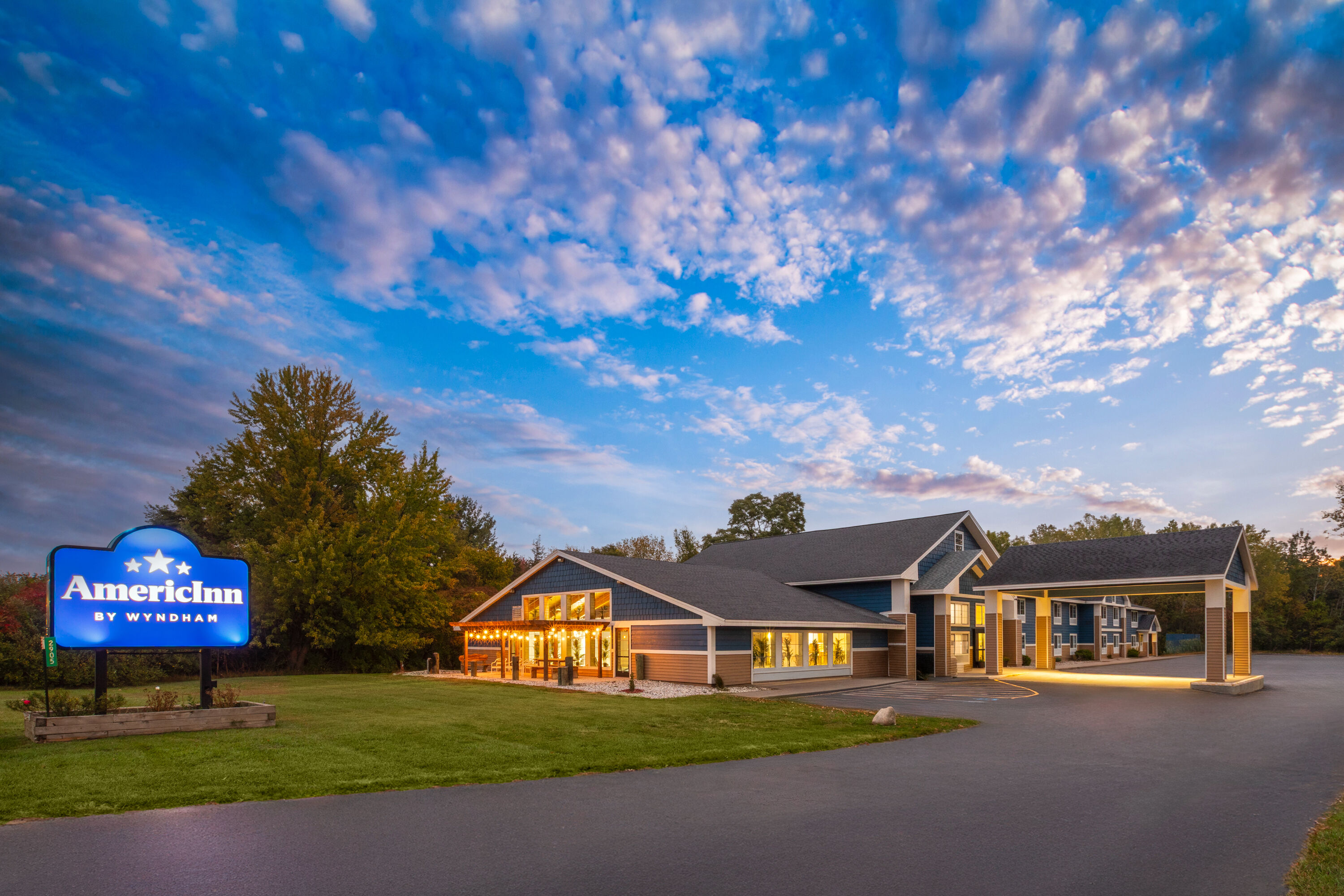 Exterior Dusk Image of AmericInn by Wyndham Douglas/Saugatuck hotel in Douglas, Michigan