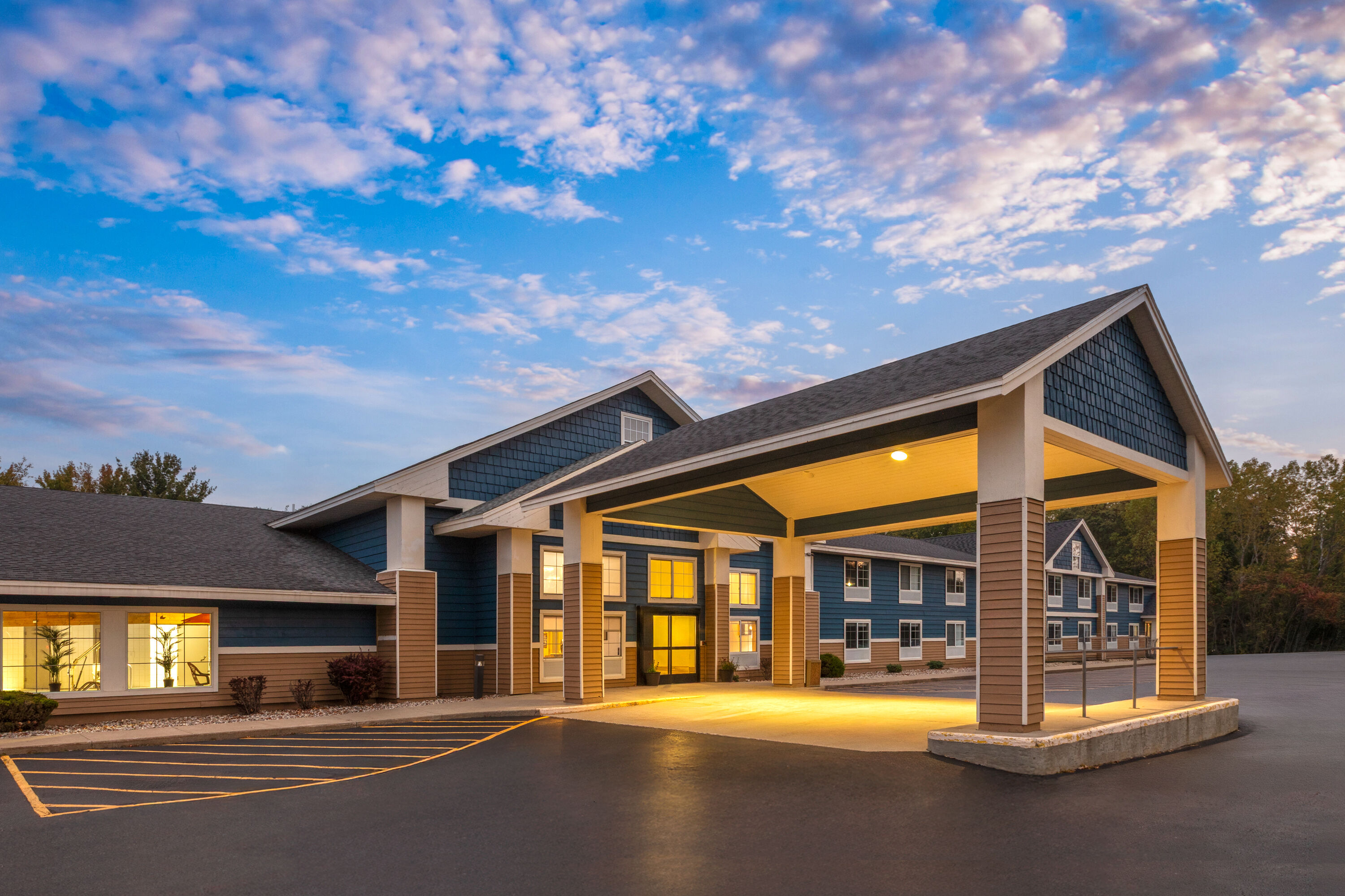 Exterior Dusk Image of AmericInn by Wyndham Douglas/Saugatuck hotel in Douglas, Michigan