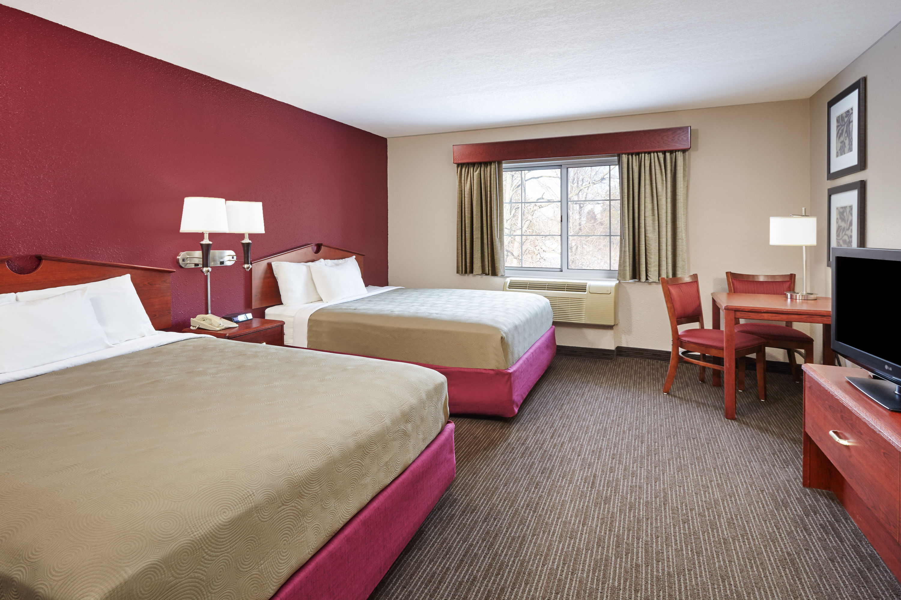 Guest room at the AmericInn by Wyndham Douglas/Saugatuck in Douglas, Michigan