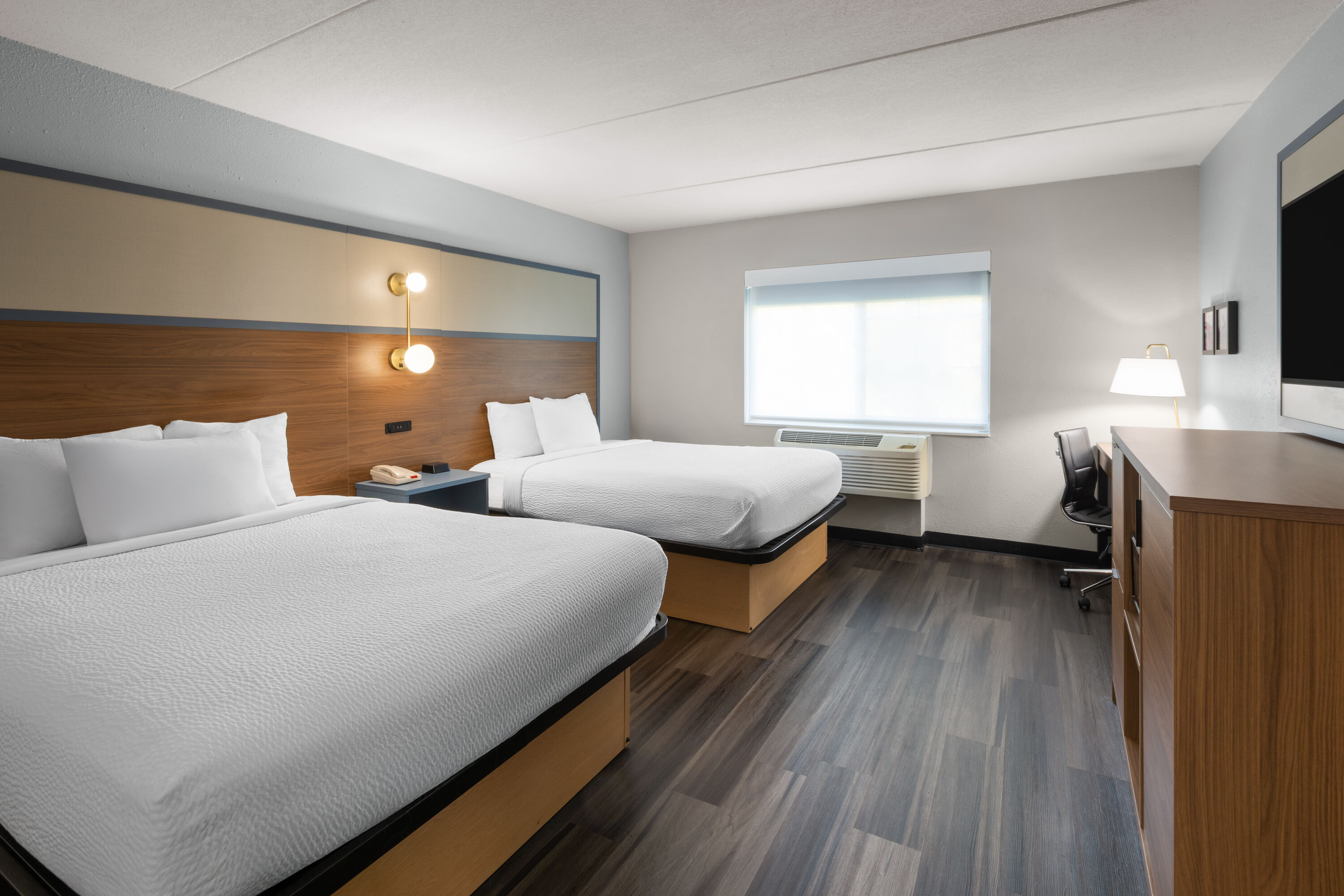 Guest room at the AmericInn by Wyndham Douglas/Saugatuck in Douglas, Michigan