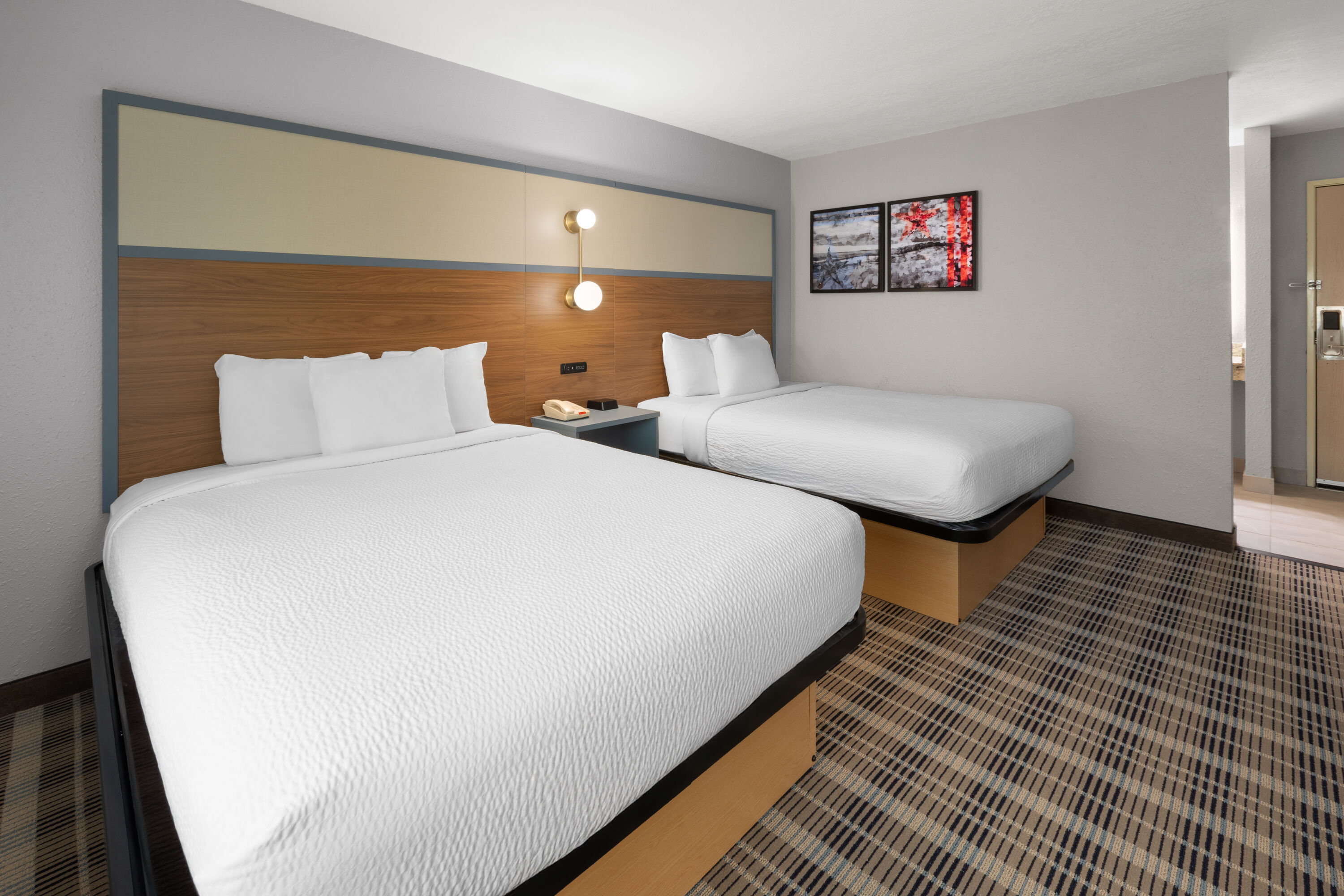 Guest room at the AmericInn by Wyndham Douglas/Saugatuck in Douglas, Michigan