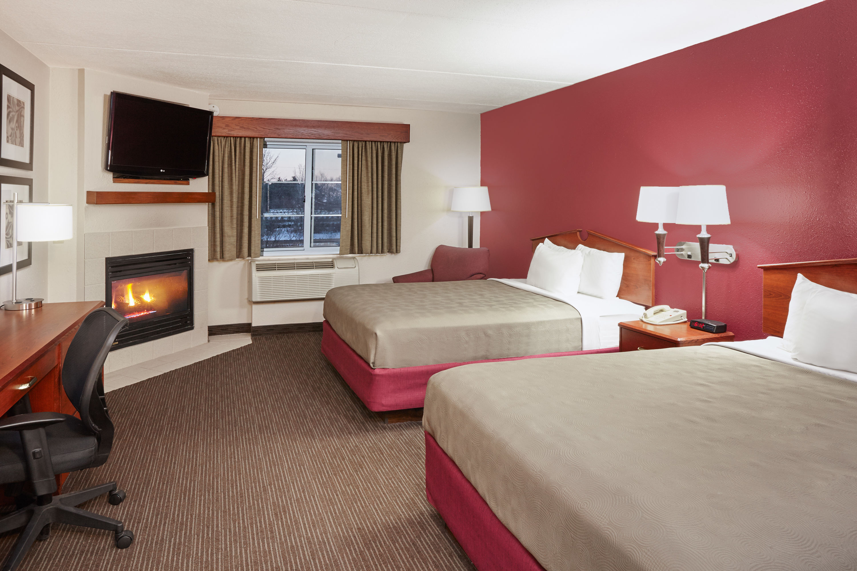 Guest room at the AmericInn by Wyndham Douglas/Saugatuck in Douglas, Michigan
