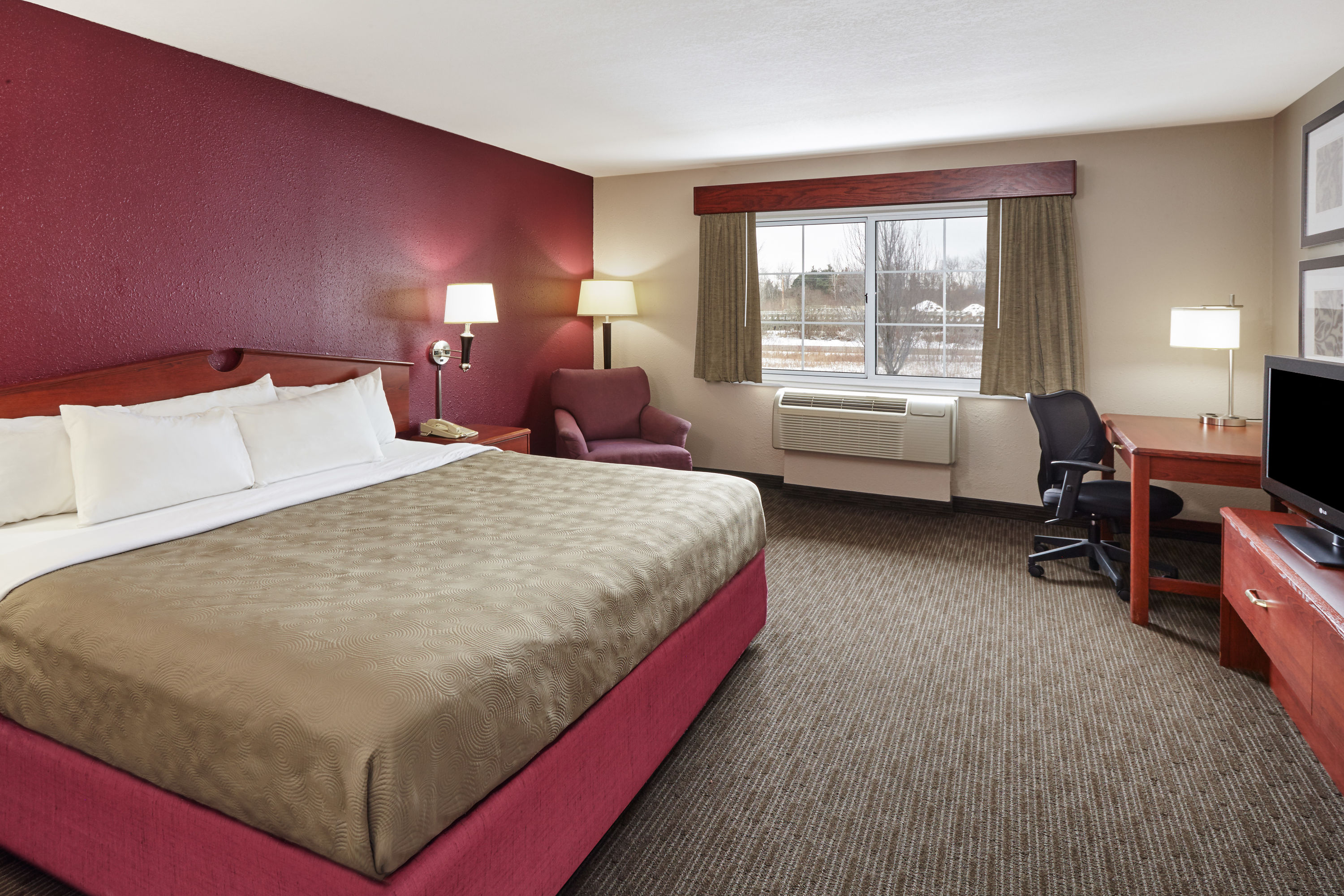 Guest room at the AmericInn by Wyndham Douglas/Saugatuck in Douglas, Michigan