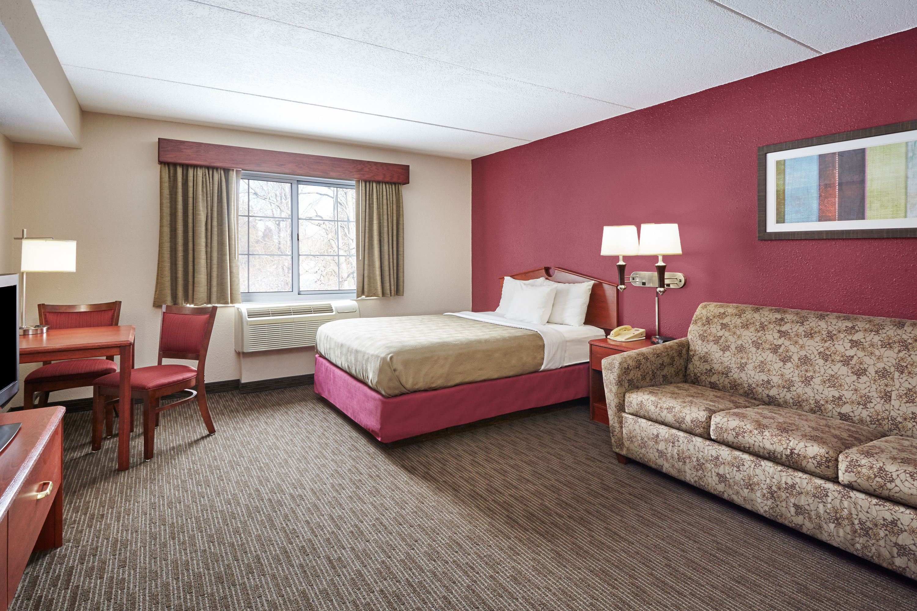 Guest room at the AmericInn by Wyndham Douglas/Saugatuck in Douglas, Michigan