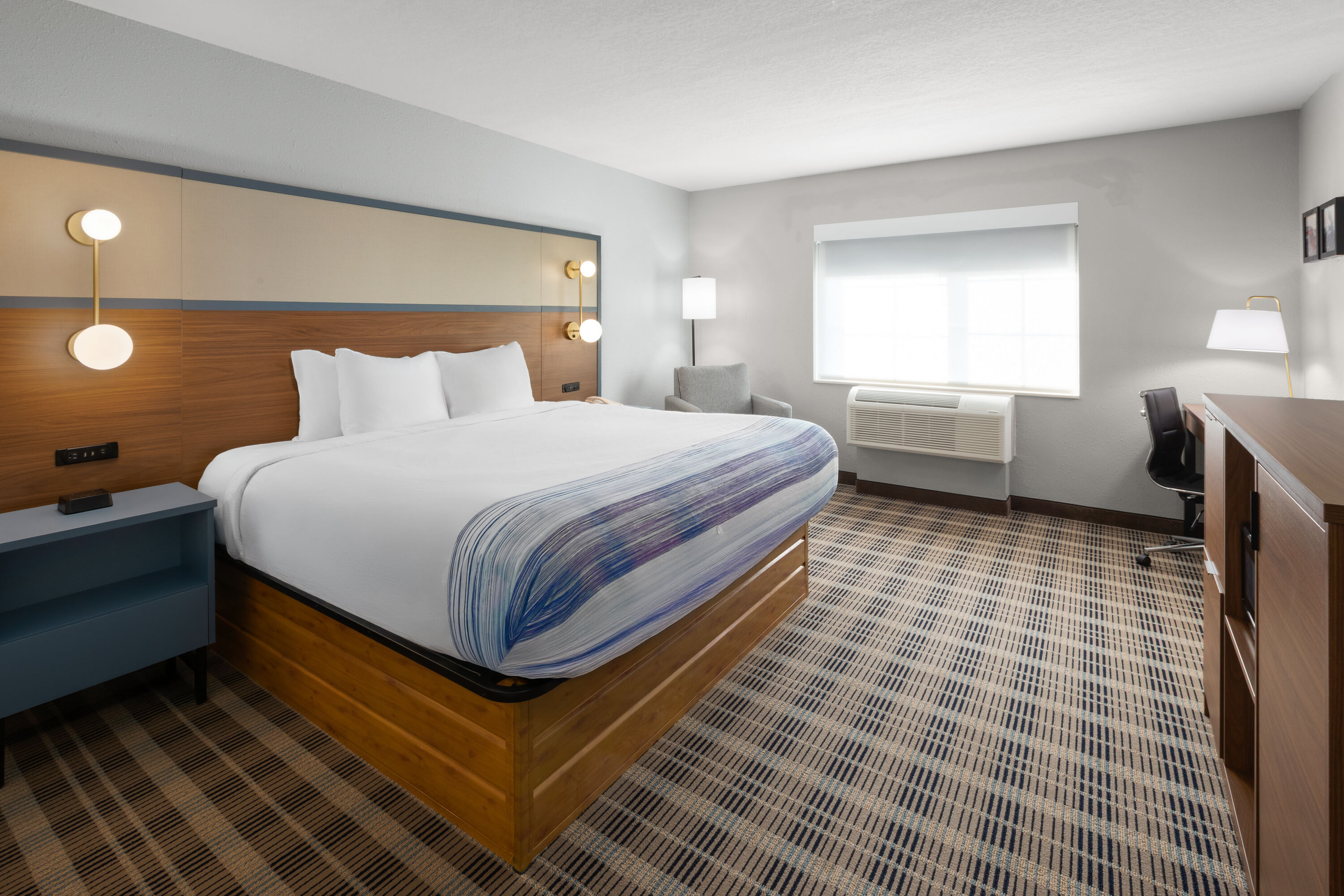 Guest room at the AmericInn by Wyndham Douglas/Saugatuck in Douglas, Michigan