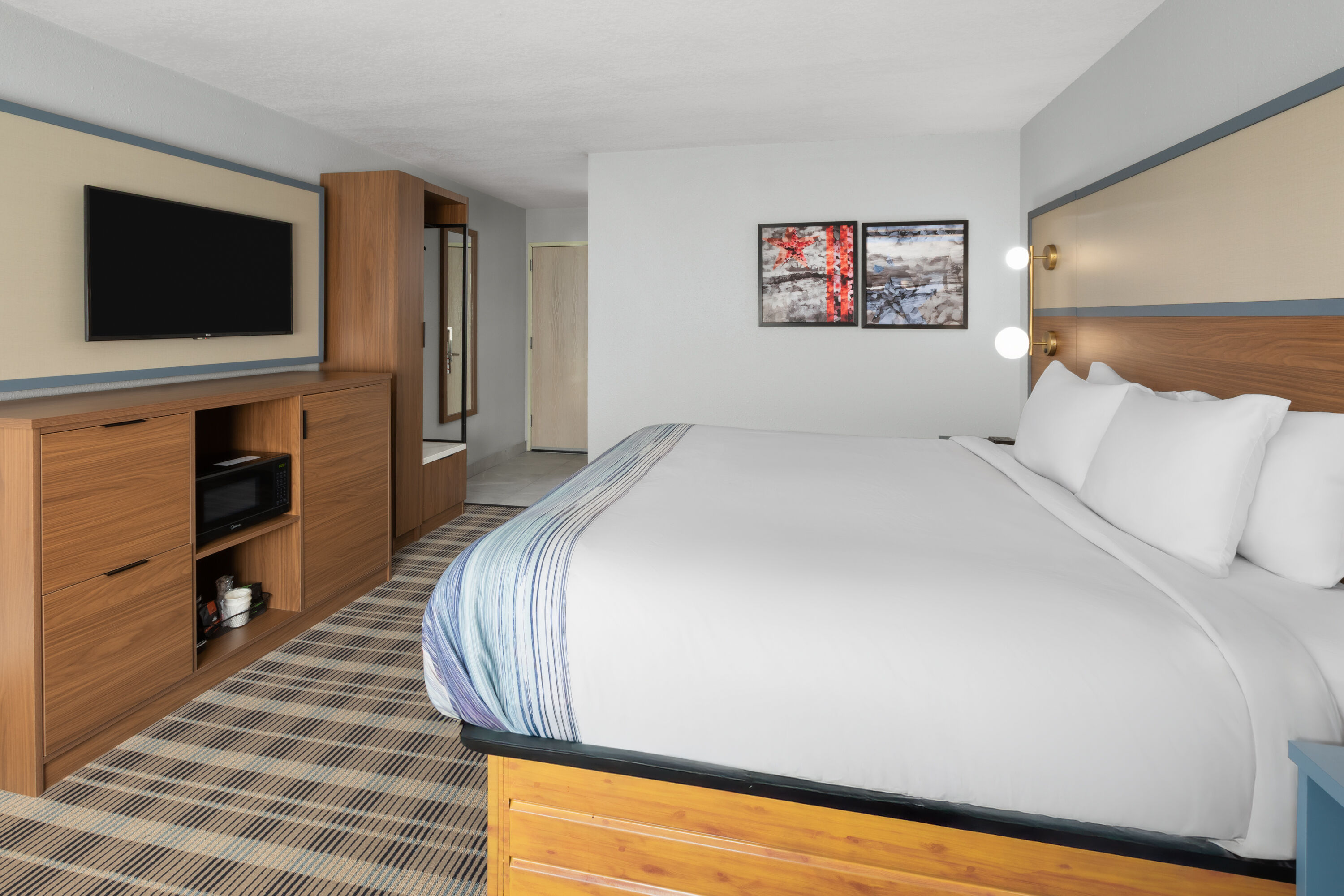 Guest room at the AmericInn by Wyndham Douglas/Saugatuck in Douglas, Michigan