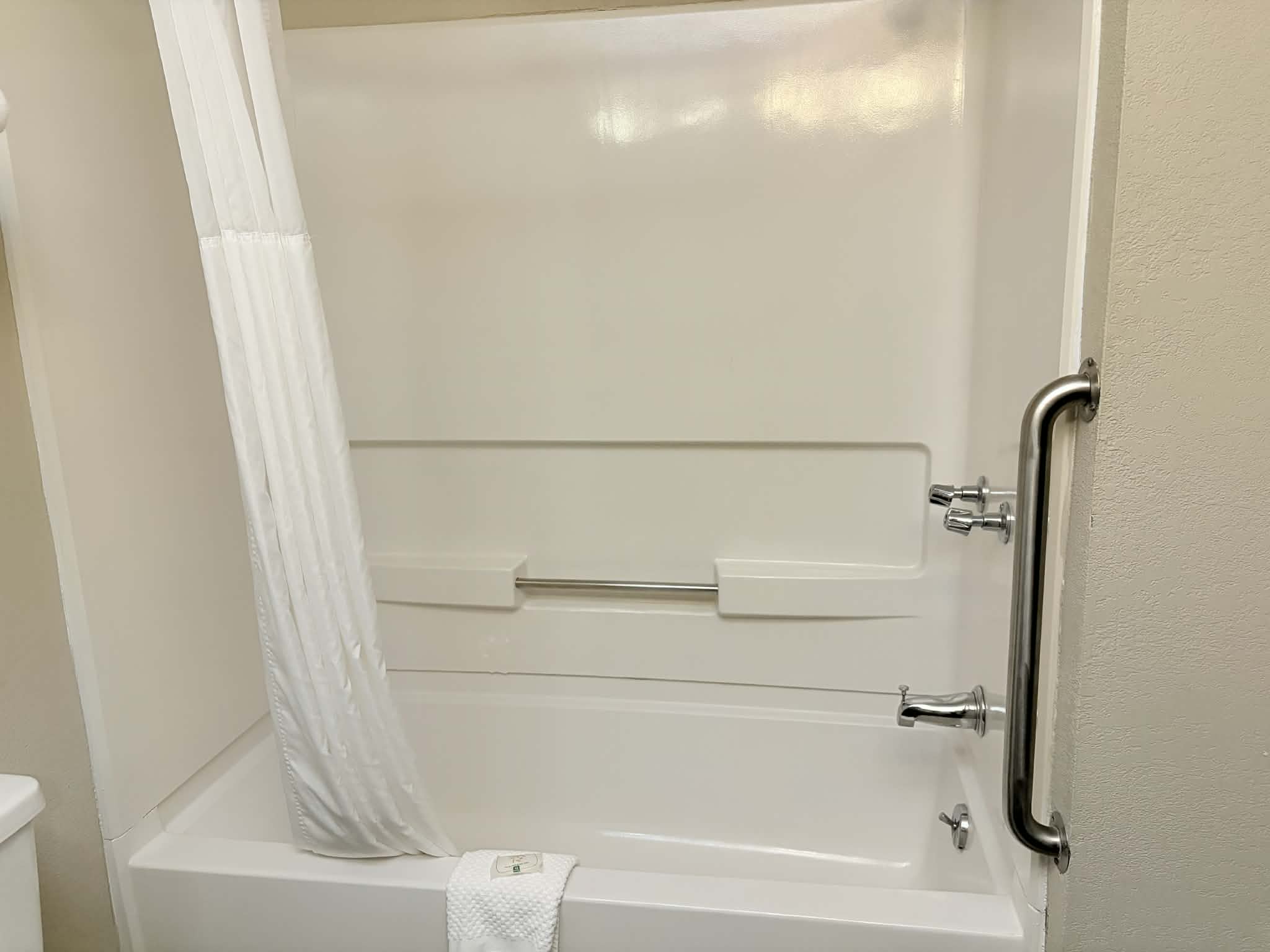 Guest room bath at the AmericInn by Wyndham Holland MI in Holland, Michigan