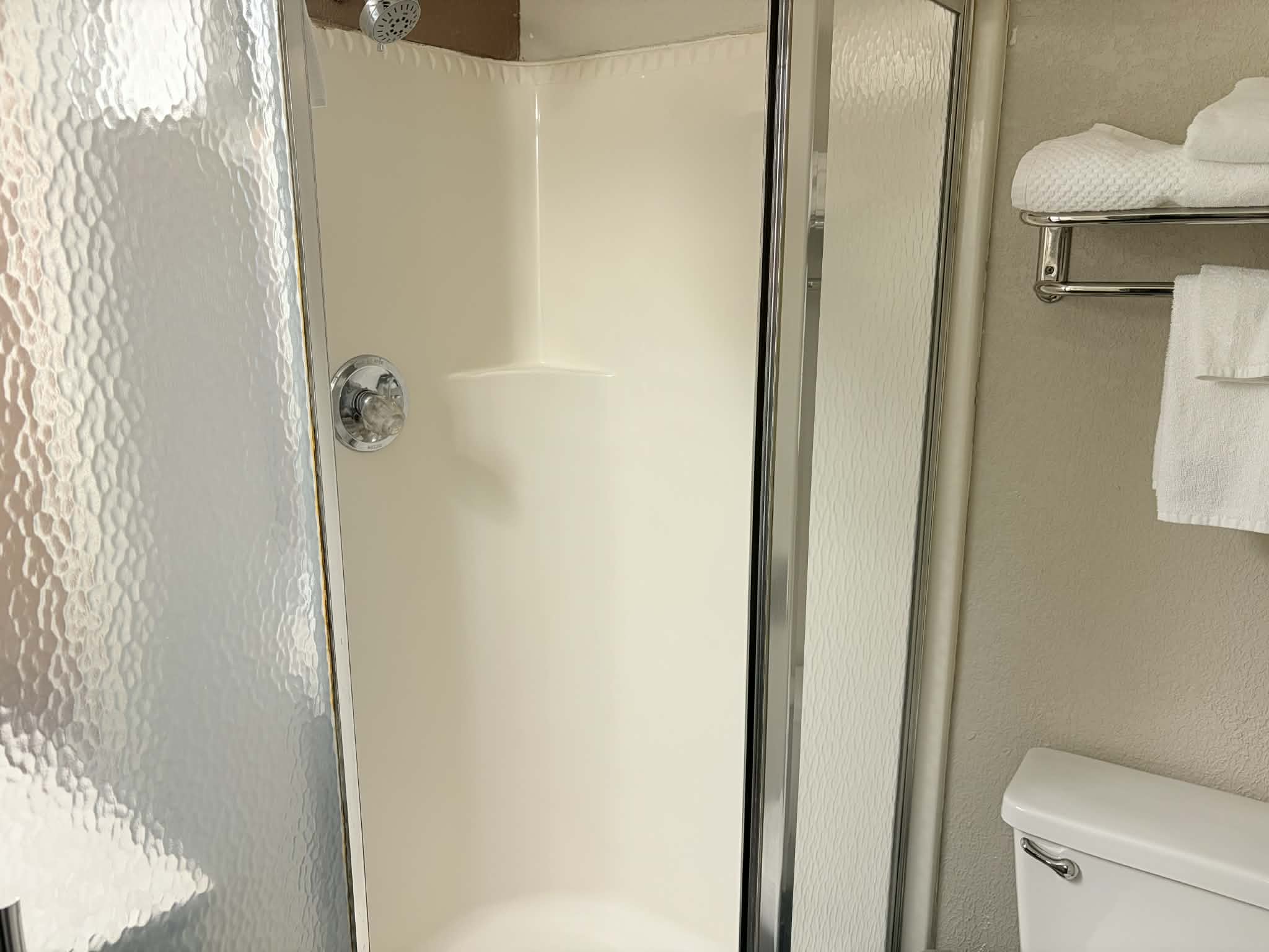 Guest room bath at the AmericInn by Wyndham Holland MI in Holland, Michigan