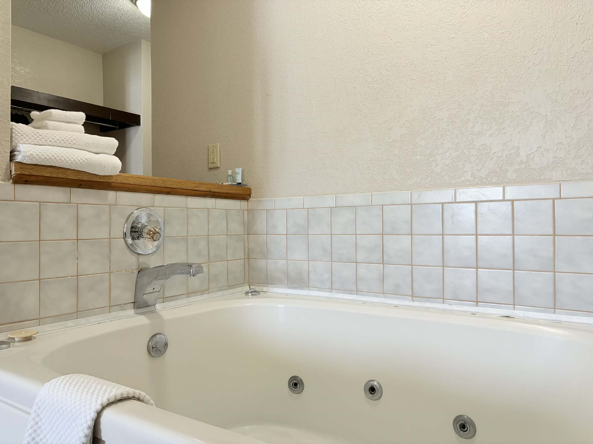 Guest room bath at the AmericInn by Wyndham Holland MI in Holland, Michigan
