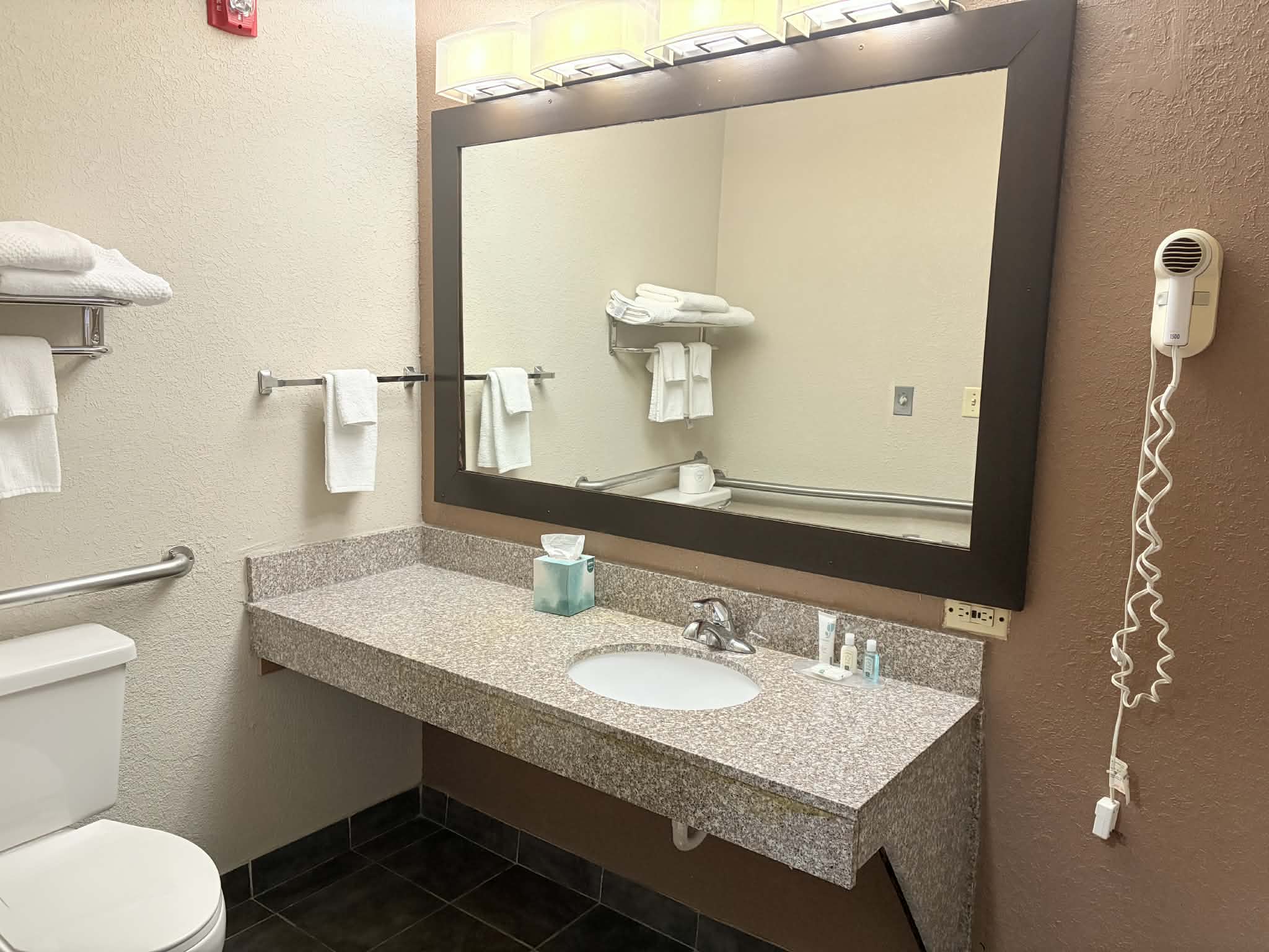 Guest room bath at the AmericInn by Wyndham Holland MI in Holland, Michigan