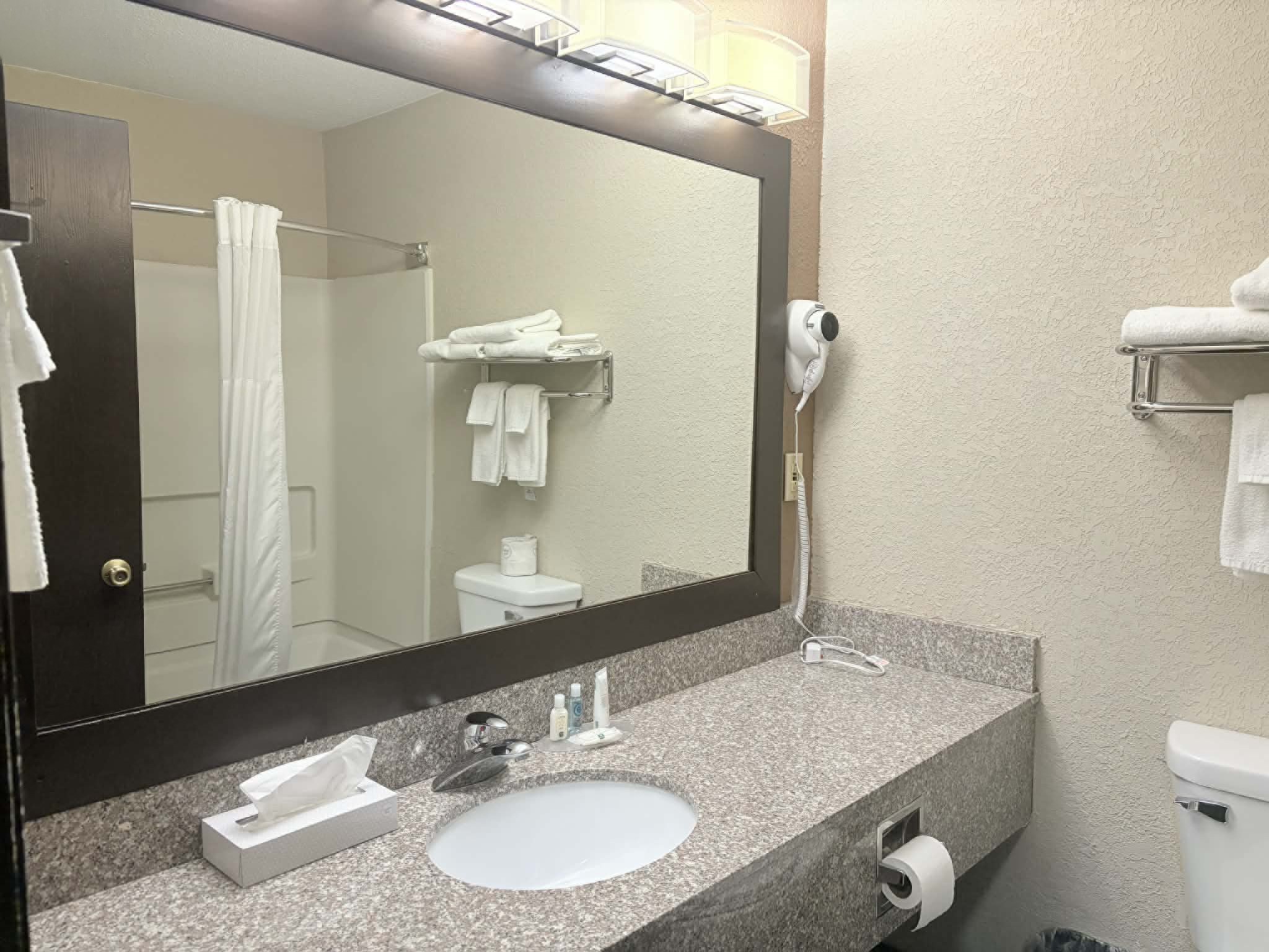 Guest room bath at the AmericInn by Wyndham Holland MI in Holland, Michigan