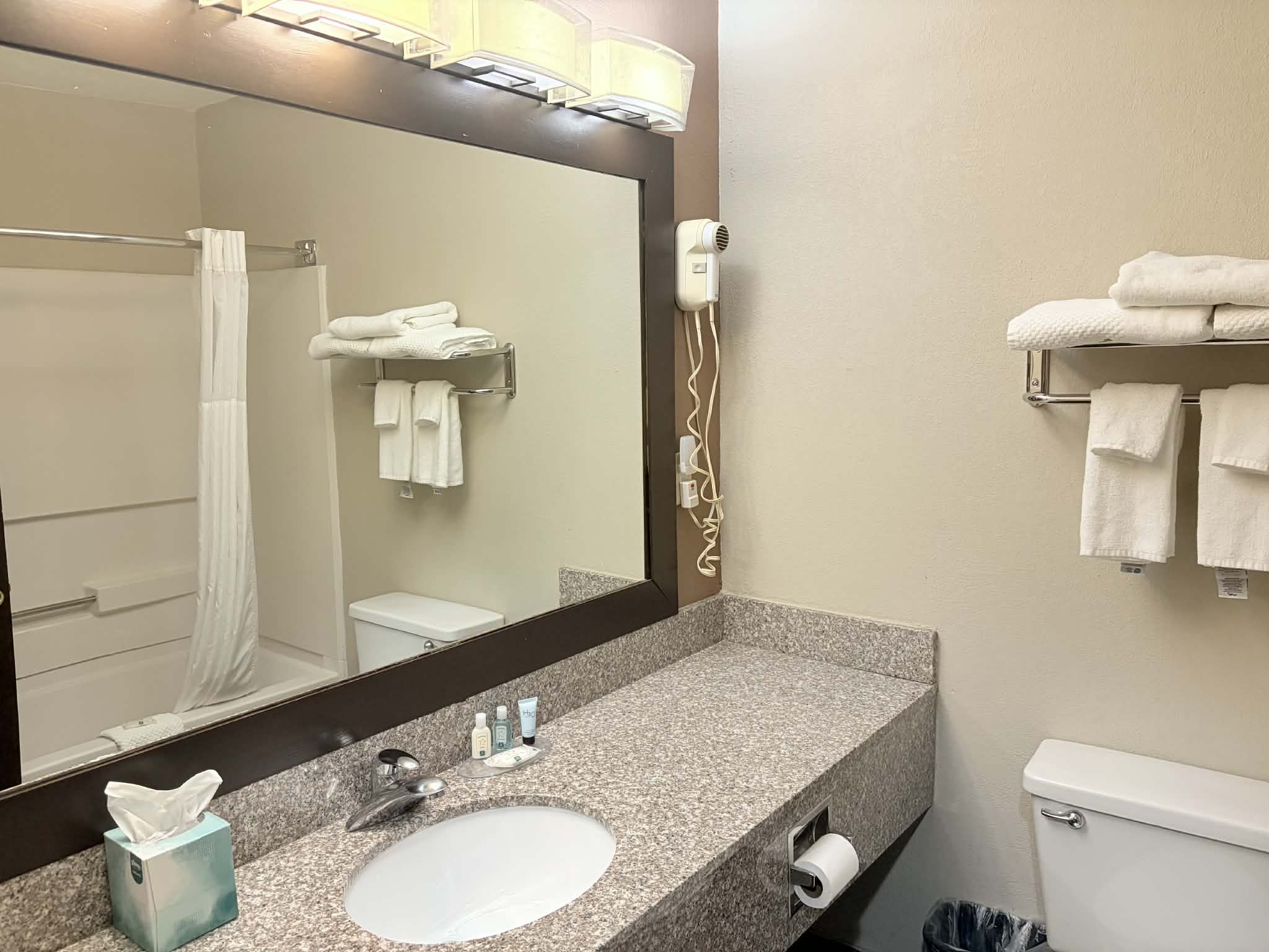 Guest room bath at the AmericInn by Wyndham Holland MI in Holland, Michigan