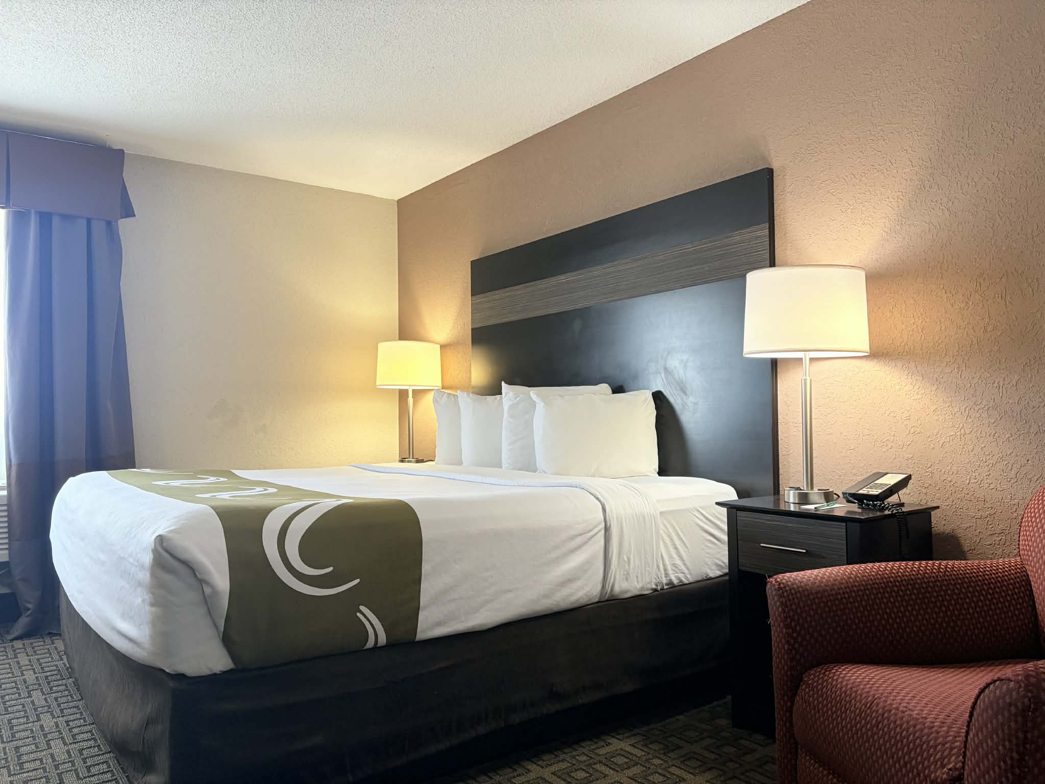 Guest room at the AmericInn by Wyndham Holland MI in Holland, Michigan