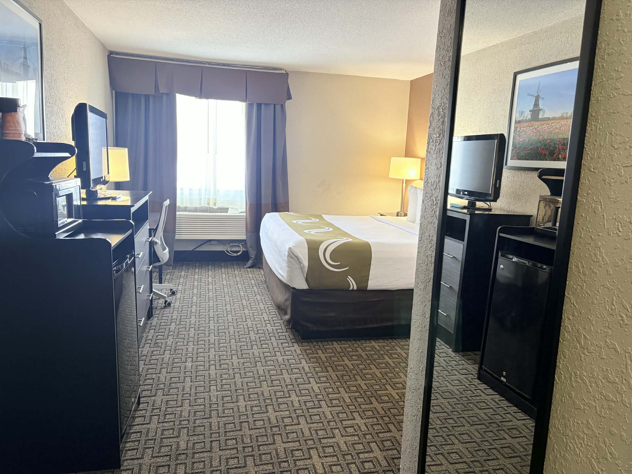 Guest room at the AmericInn by Wyndham Holland MI in Holland, Michigan