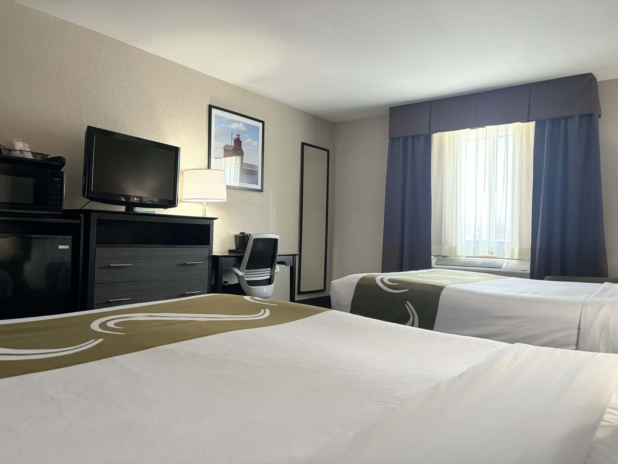 Guest room at the AmericInn by Wyndham Holland MI in Holland, Michigan