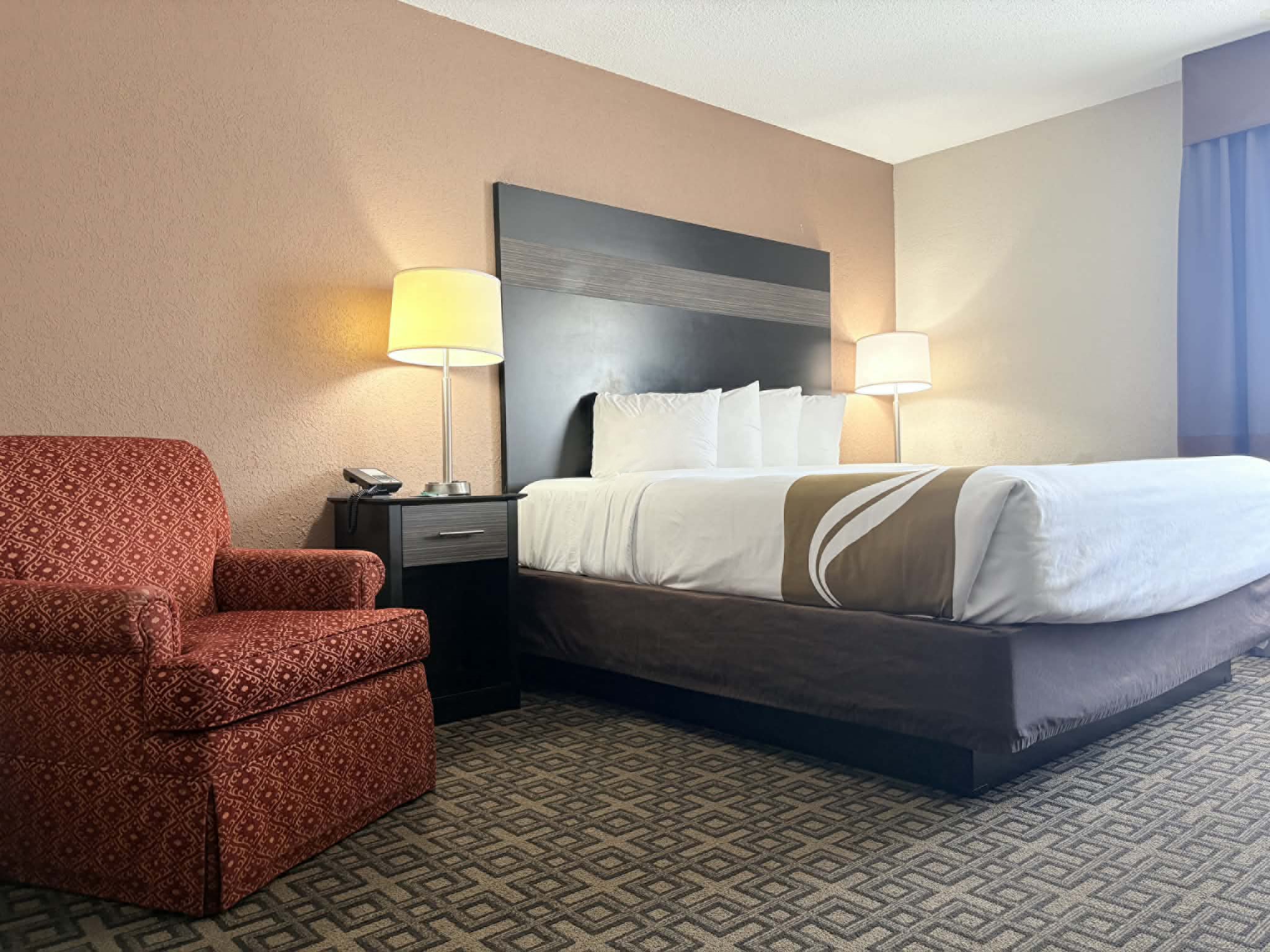 Guest room at the AmericInn by Wyndham Holland MI in Holland, Michigan