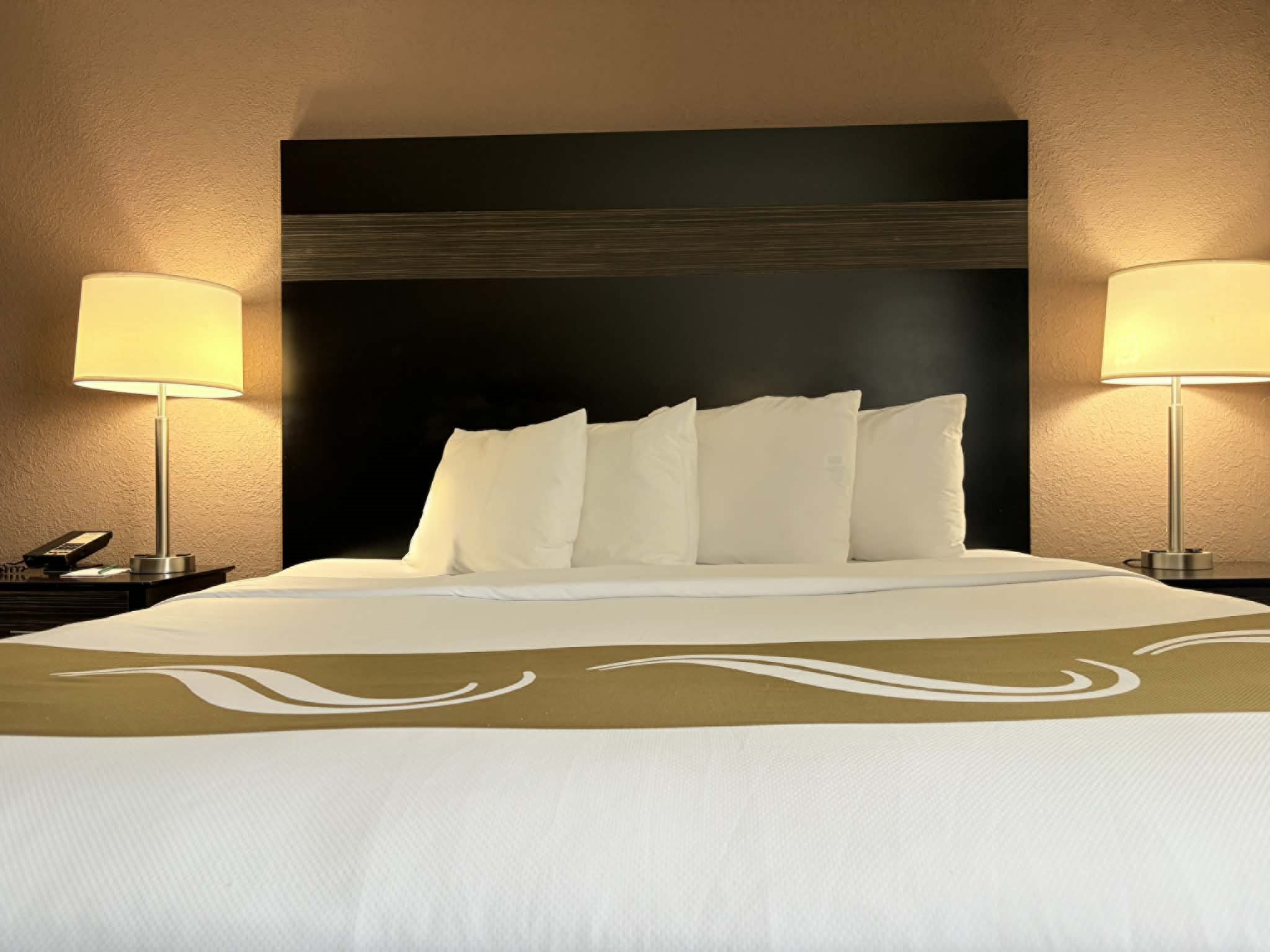 Guest room at the AmericInn by Wyndham Holland MI in Holland, Michigan