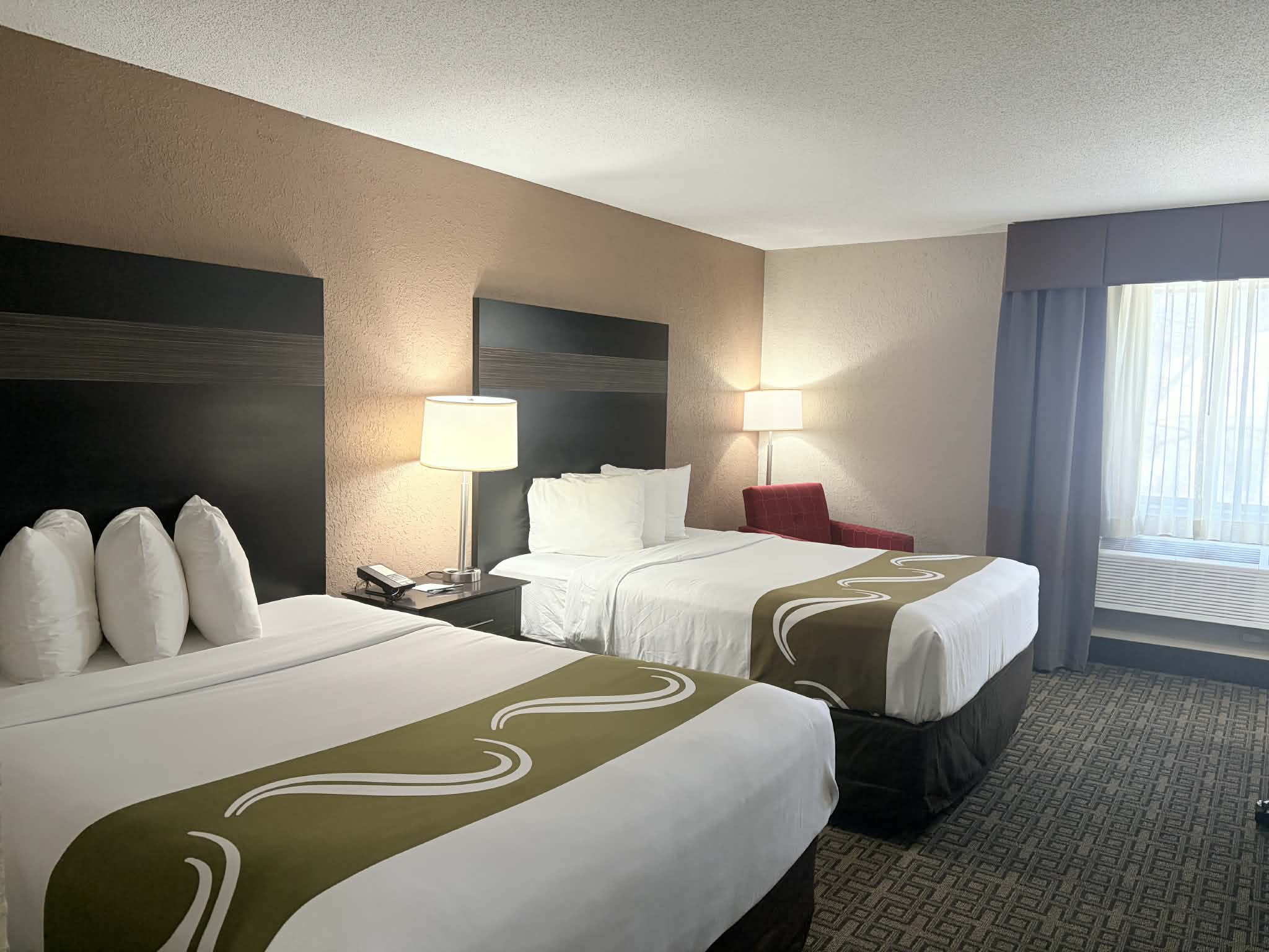 Guest room at the AmericInn by Wyndham Holland MI in Holland, Michigan