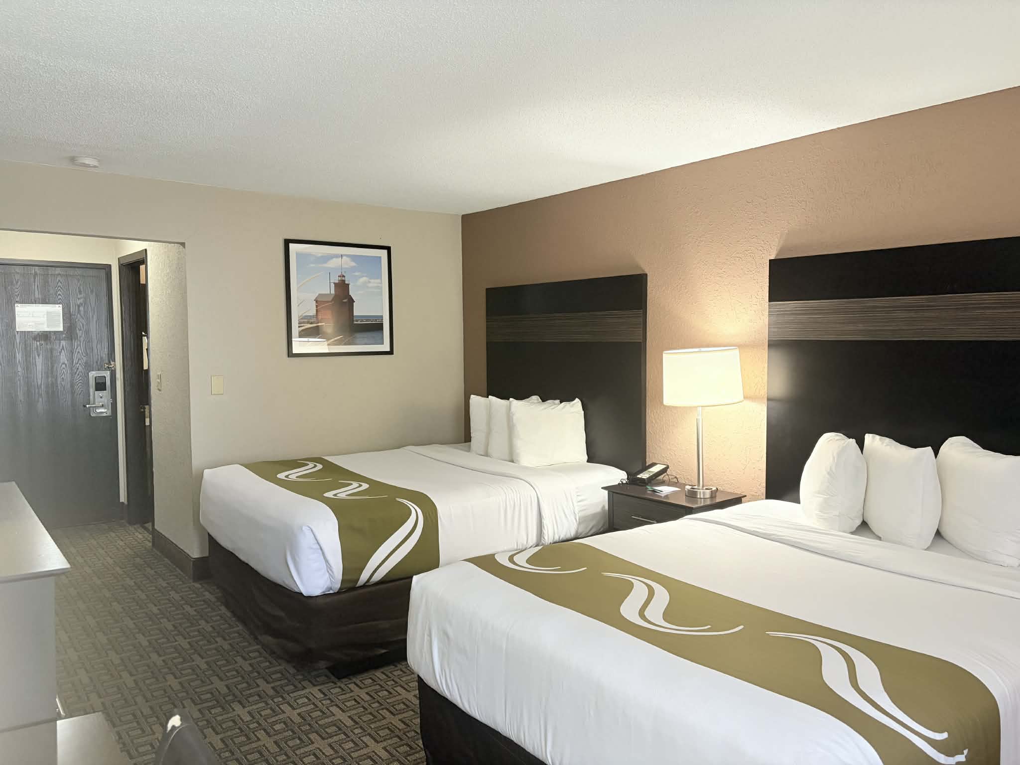 Guest room at the AmericInn by Wyndham Holland MI in Holland, Michigan