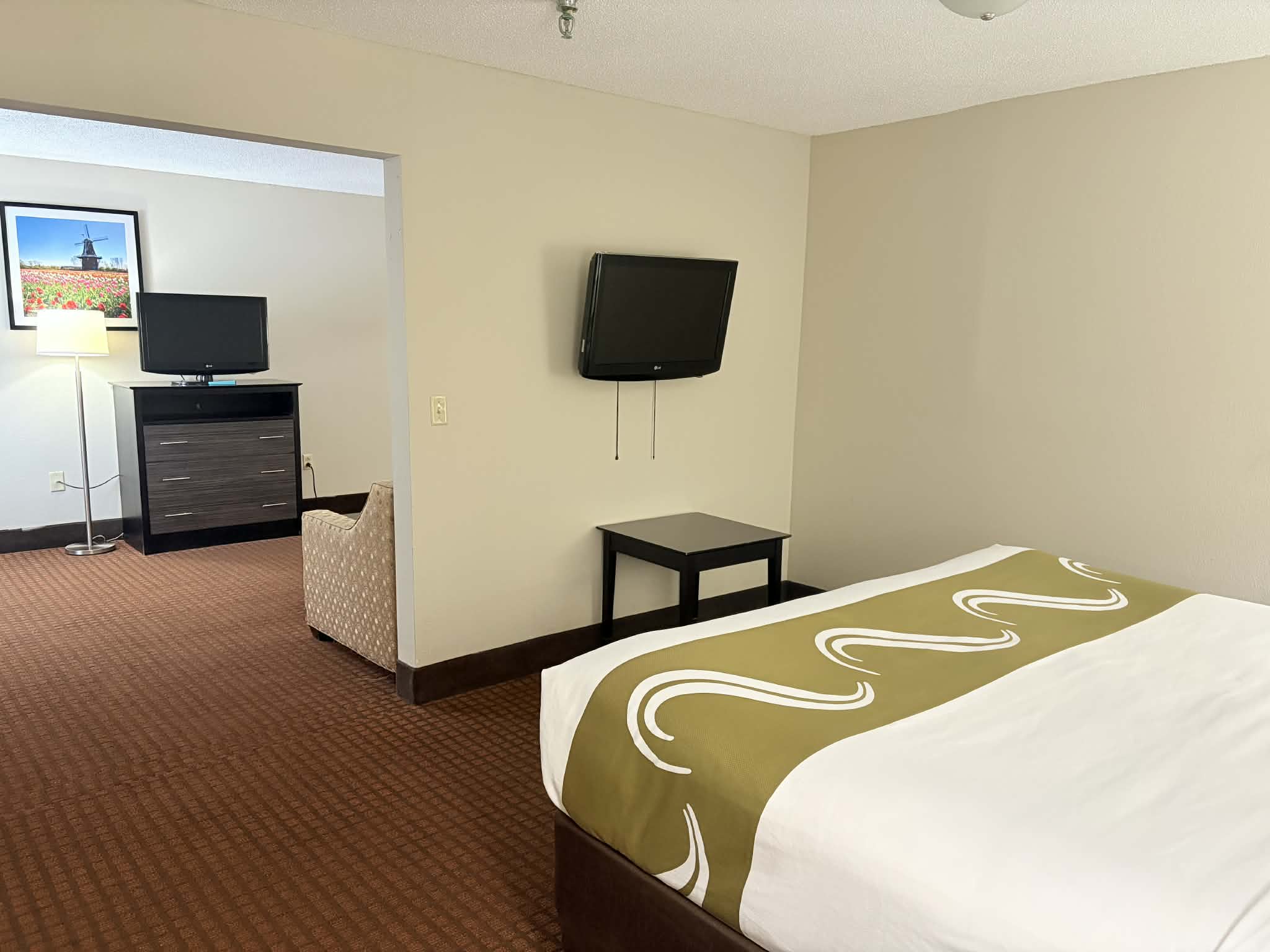 Guest room at the AmericInn by Wyndham Holland MI in Holland, Michigan