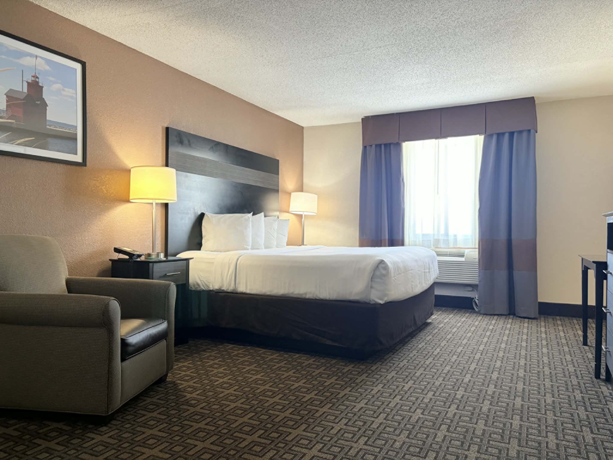 Guest room at the AmericInn by Wyndham Holland MI in Holland, Michigan