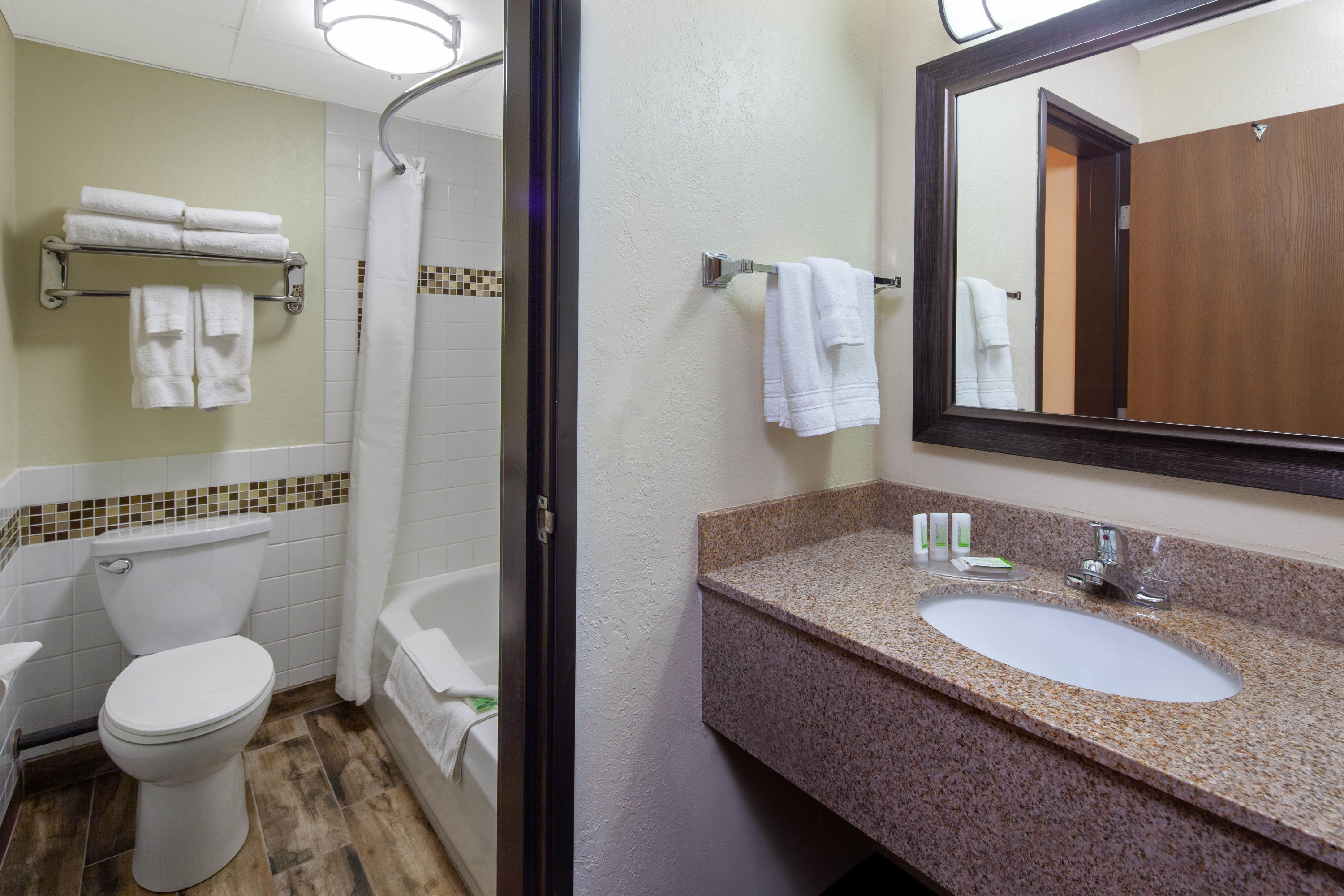 Guest room bath at the AmericInn by Wyndham Ironwood in Ironwood, Michigan
