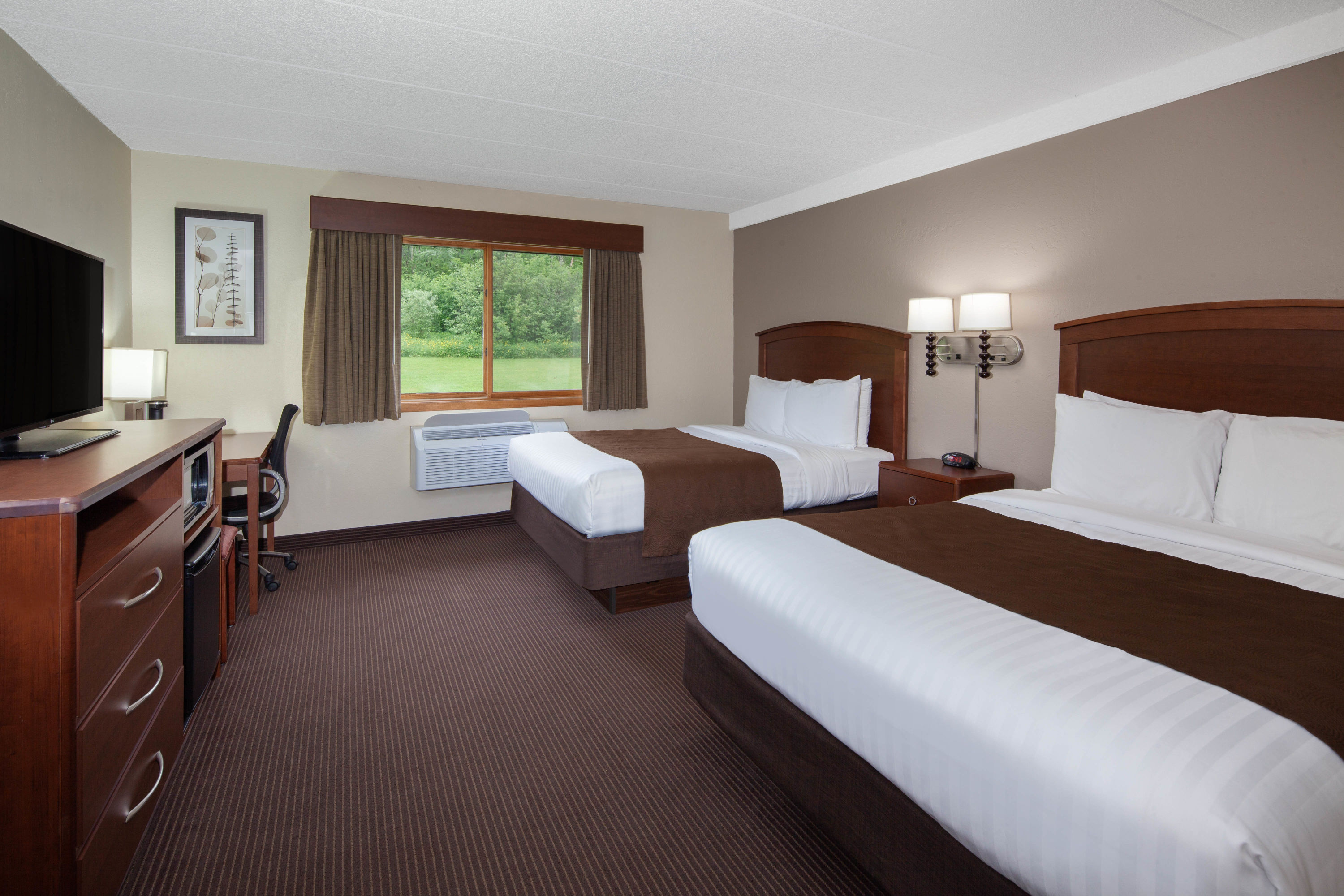 Guest room at the AmericInn by Wyndham Ironwood in Ironwood, Michigan