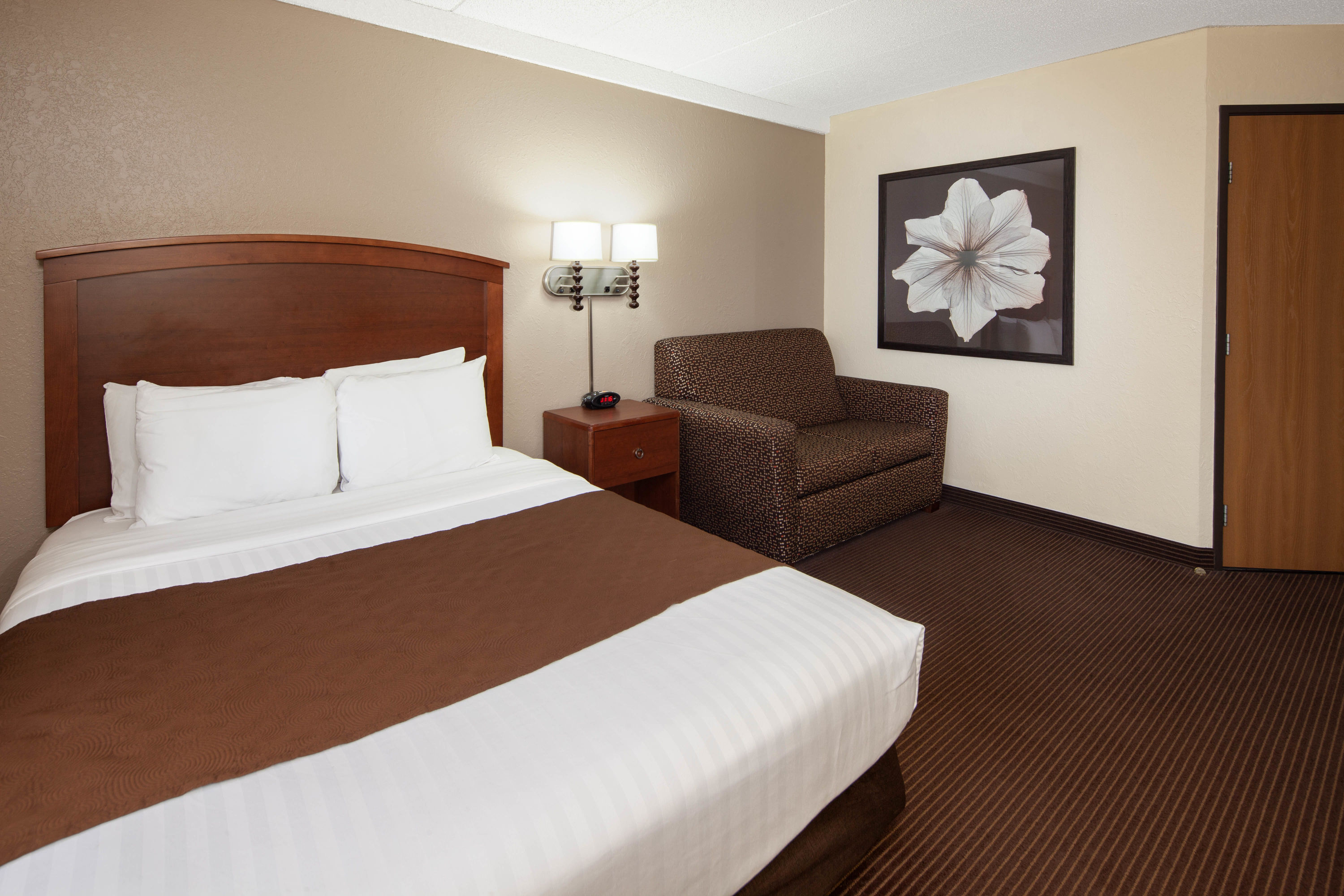 Guest room at the AmericInn by Wyndham Ironwood in Ironwood, Michigan