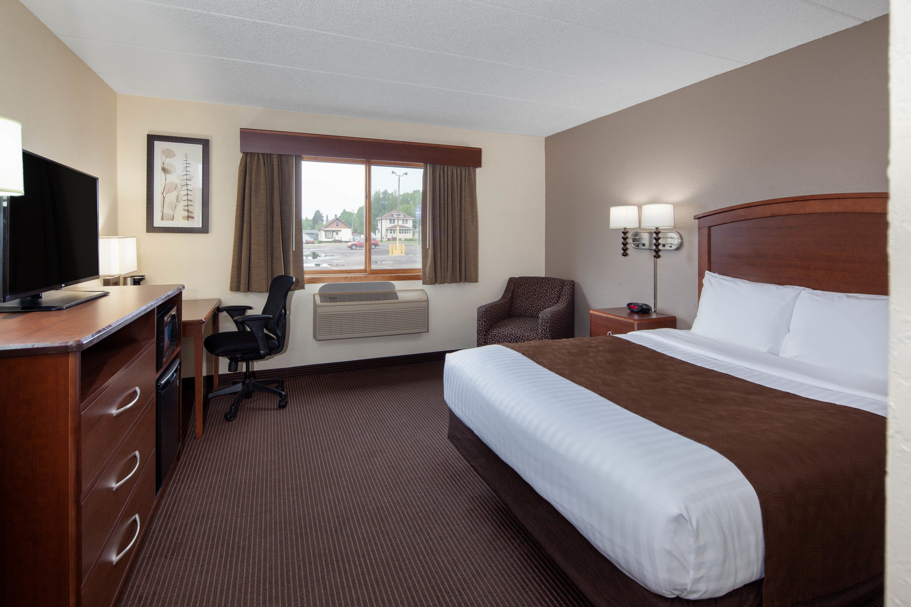 Guest room at the AmericInn by Wyndham Ironwood in Ironwood, Michigan