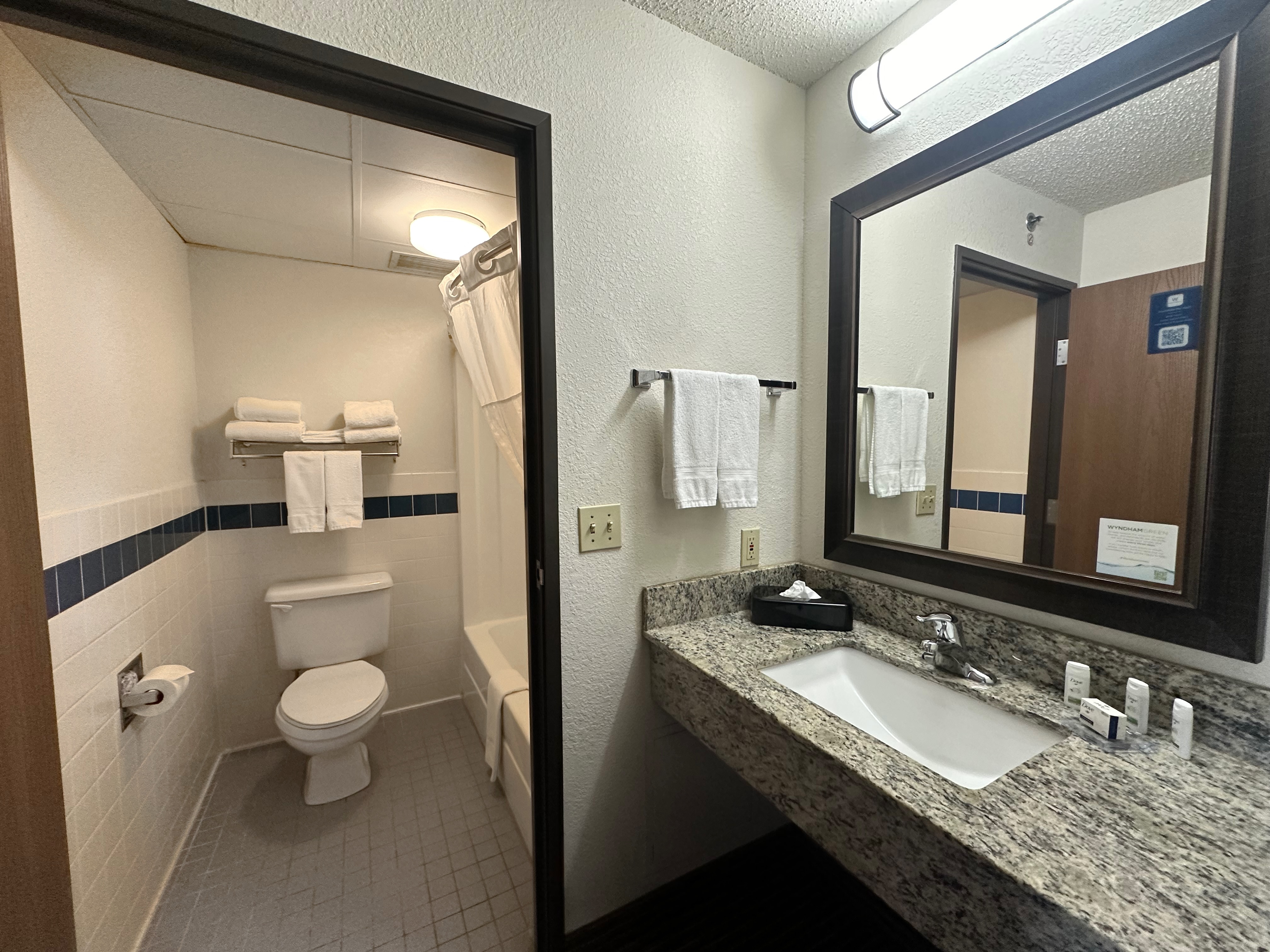 Guest room bath at the AmericInn by Wyndham Menominee in Menominee, Michigan