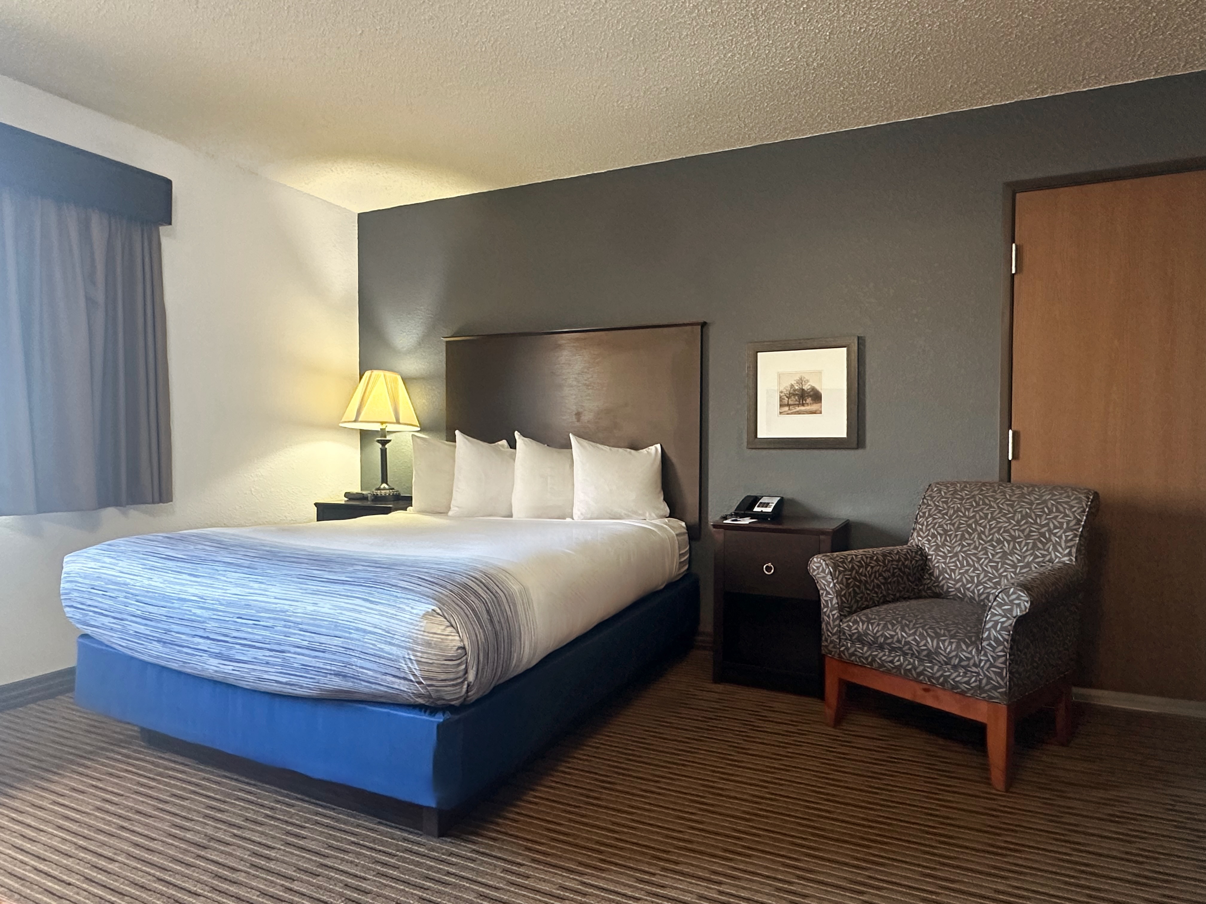 Guest room at the AmericInn by Wyndham Menominee in Menominee, Michigan