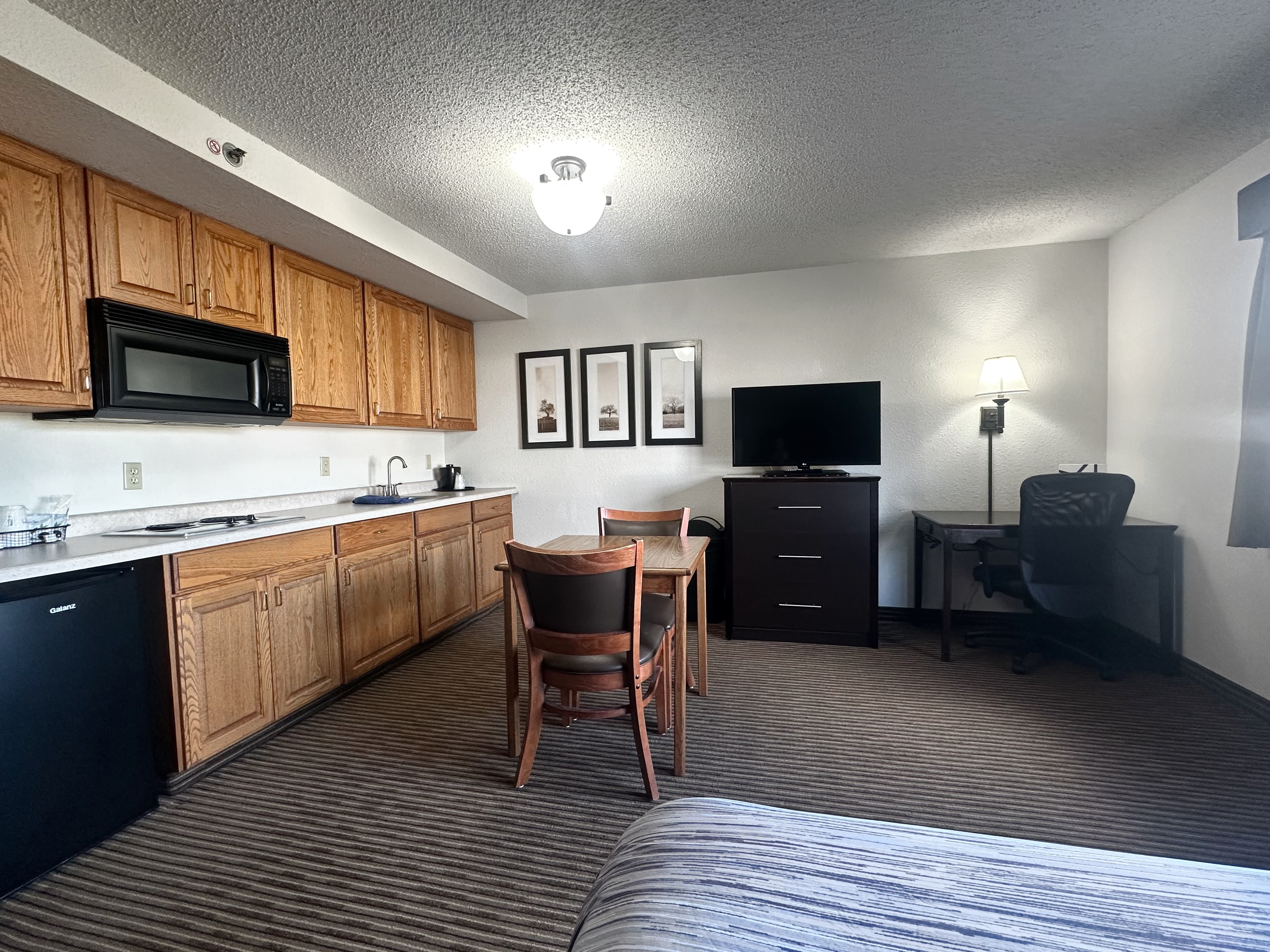 Guest room at the AmericInn by Wyndham Menominee in Menominee, Michigan