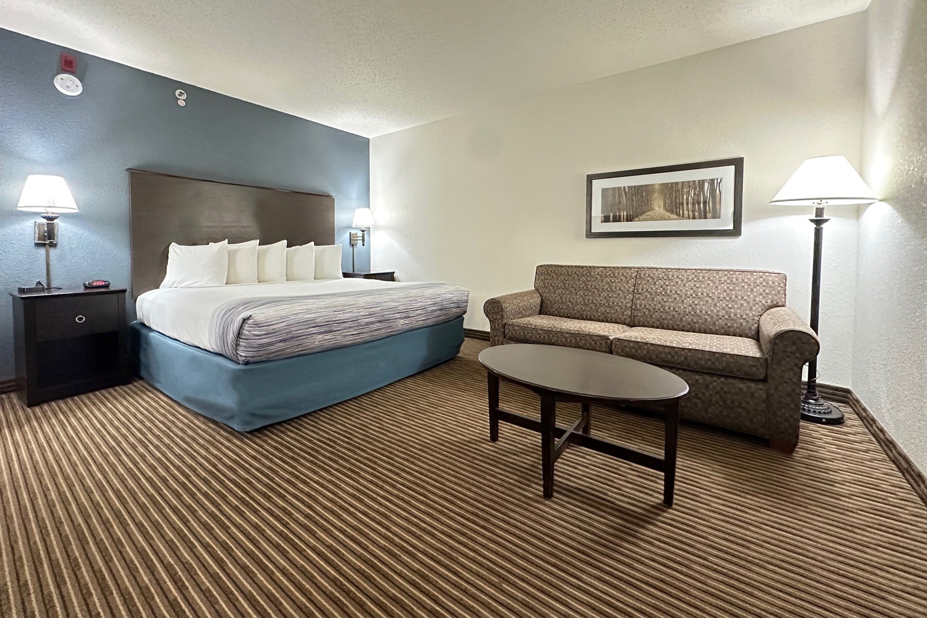 Guest room at the AmericInn by Wyndham Menominee in Menominee, Michigan