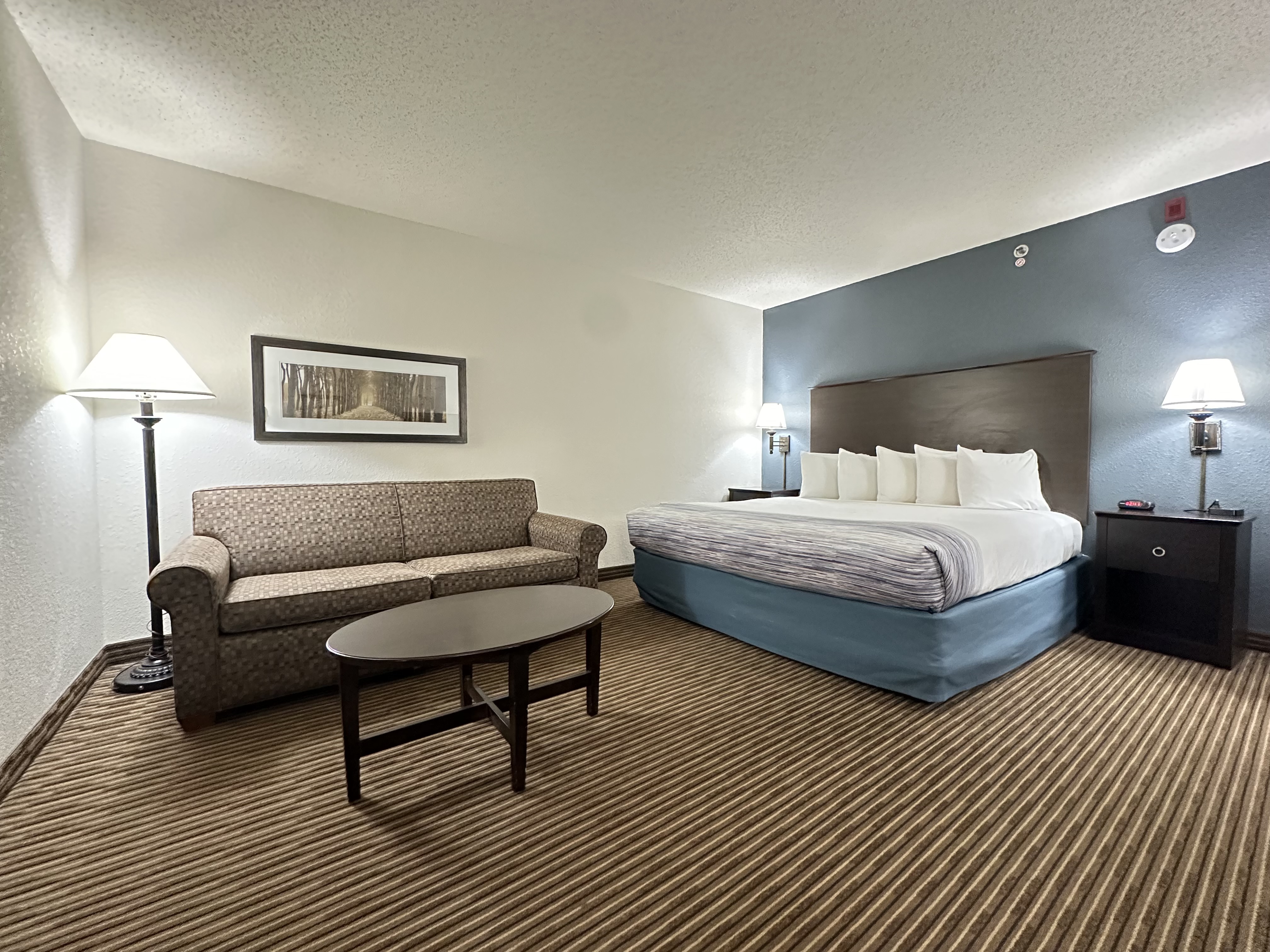 Guest room at the AmericInn by Wyndham Menominee in Menominee, Michigan