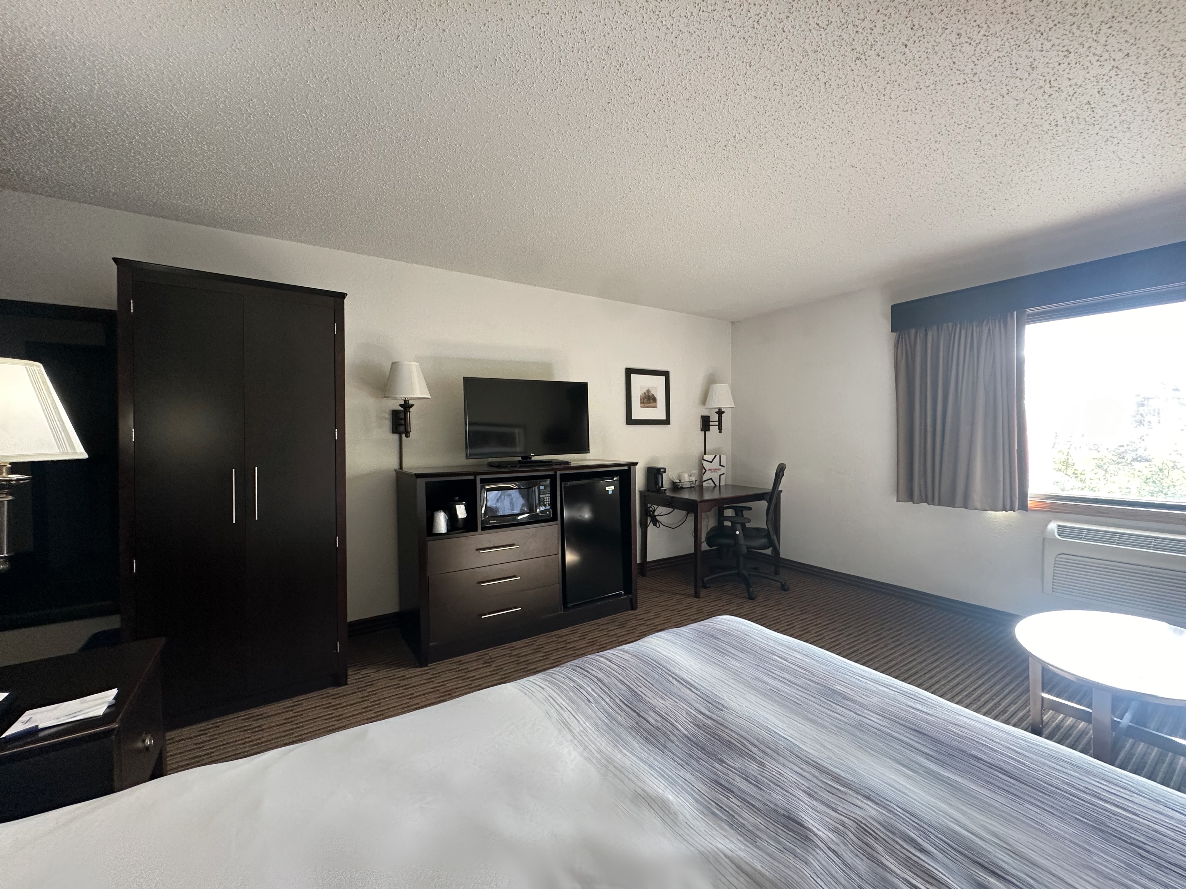 Guest room at the AmericInn by Wyndham Menominee in Menominee, Michigan