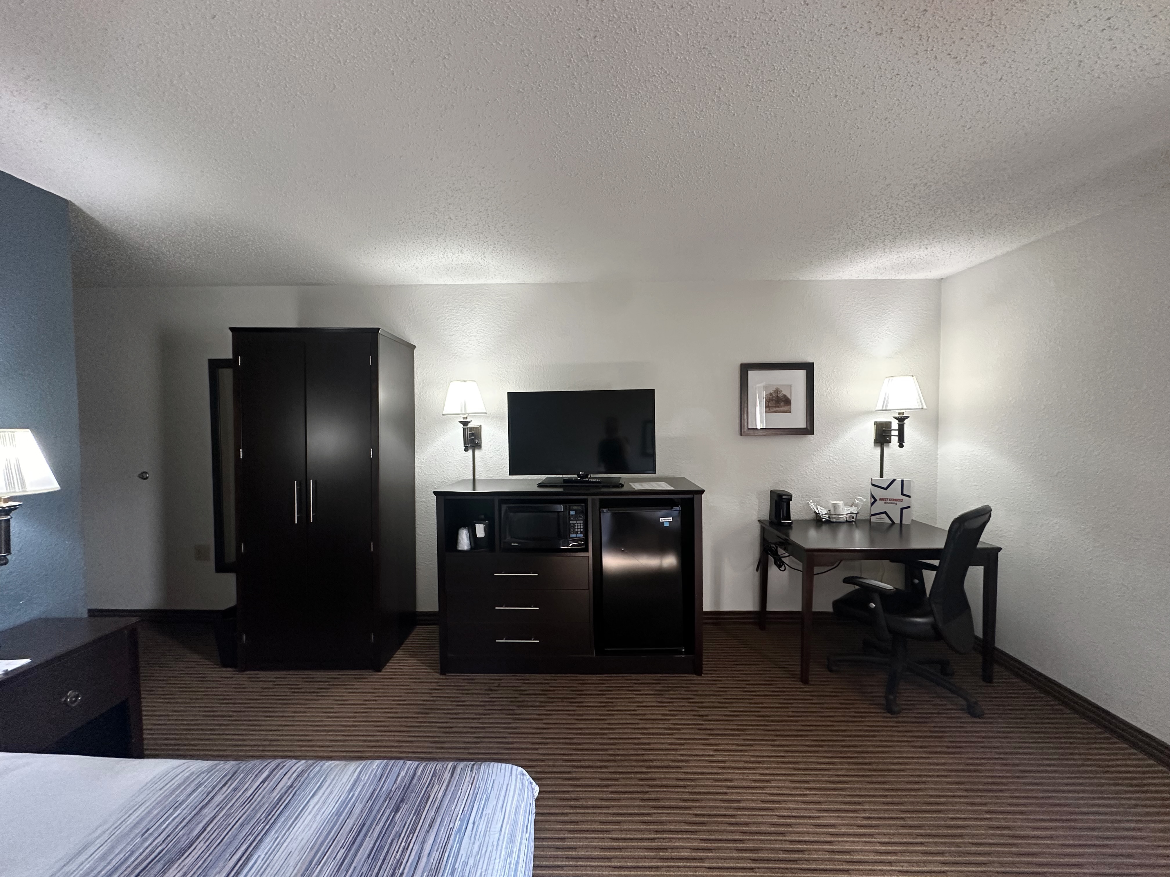 Guest room at the AmericInn by Wyndham Menominee in Menominee, Michigan