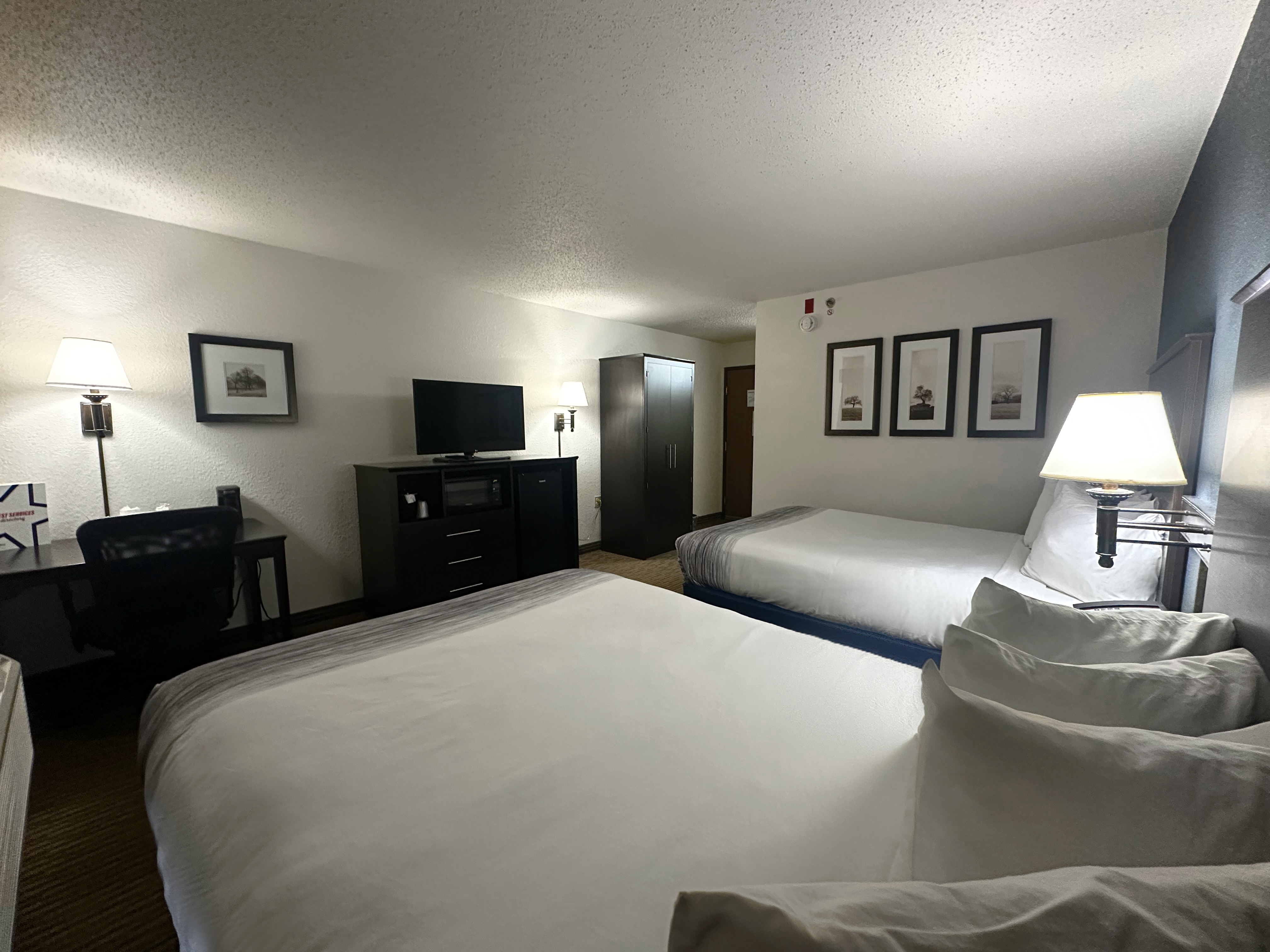 Guest room at the AmericInn by Wyndham Menominee in Menominee, Michigan