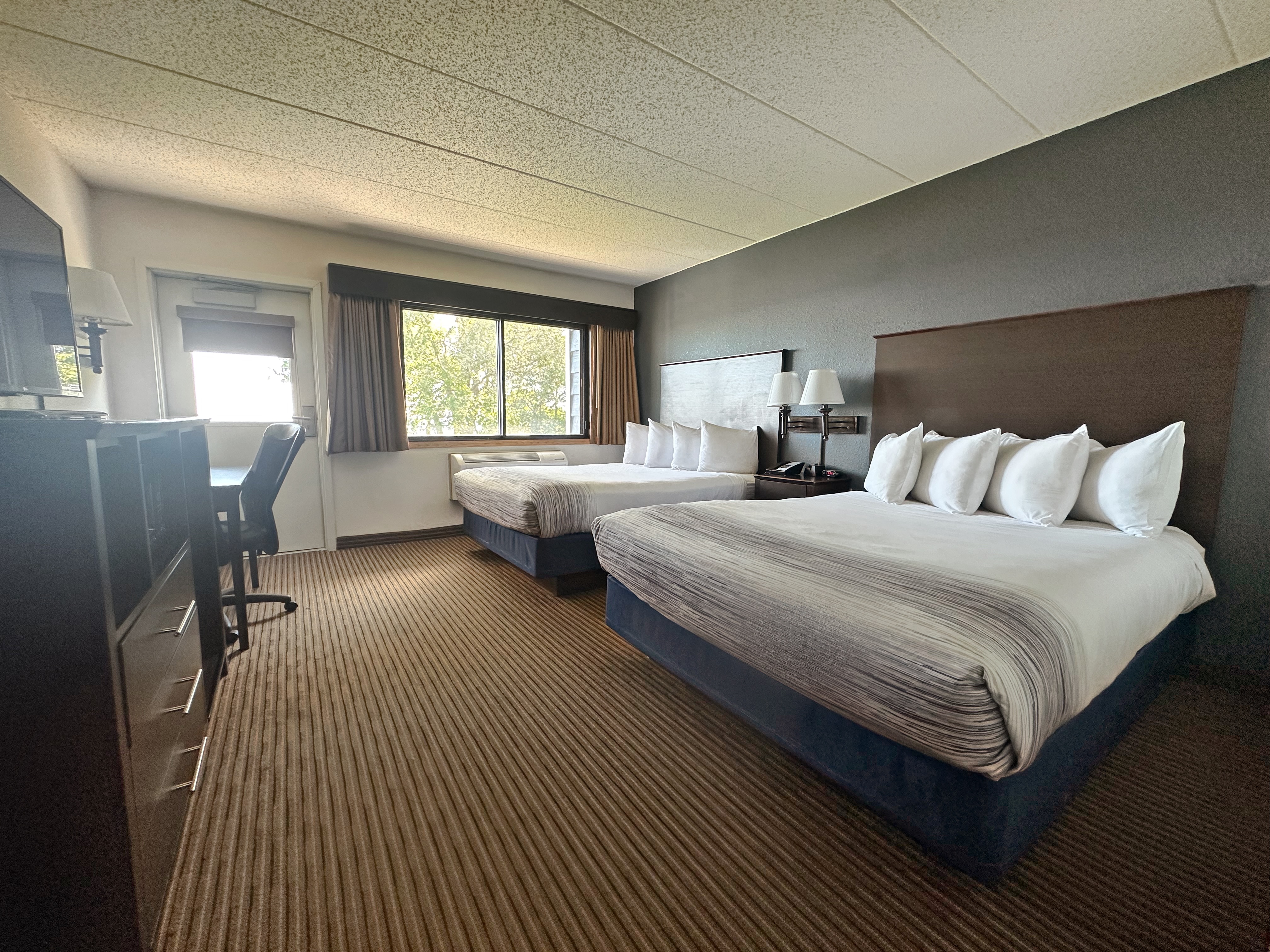 Guest room at the AmericInn by Wyndham Menominee in Menominee, Michigan