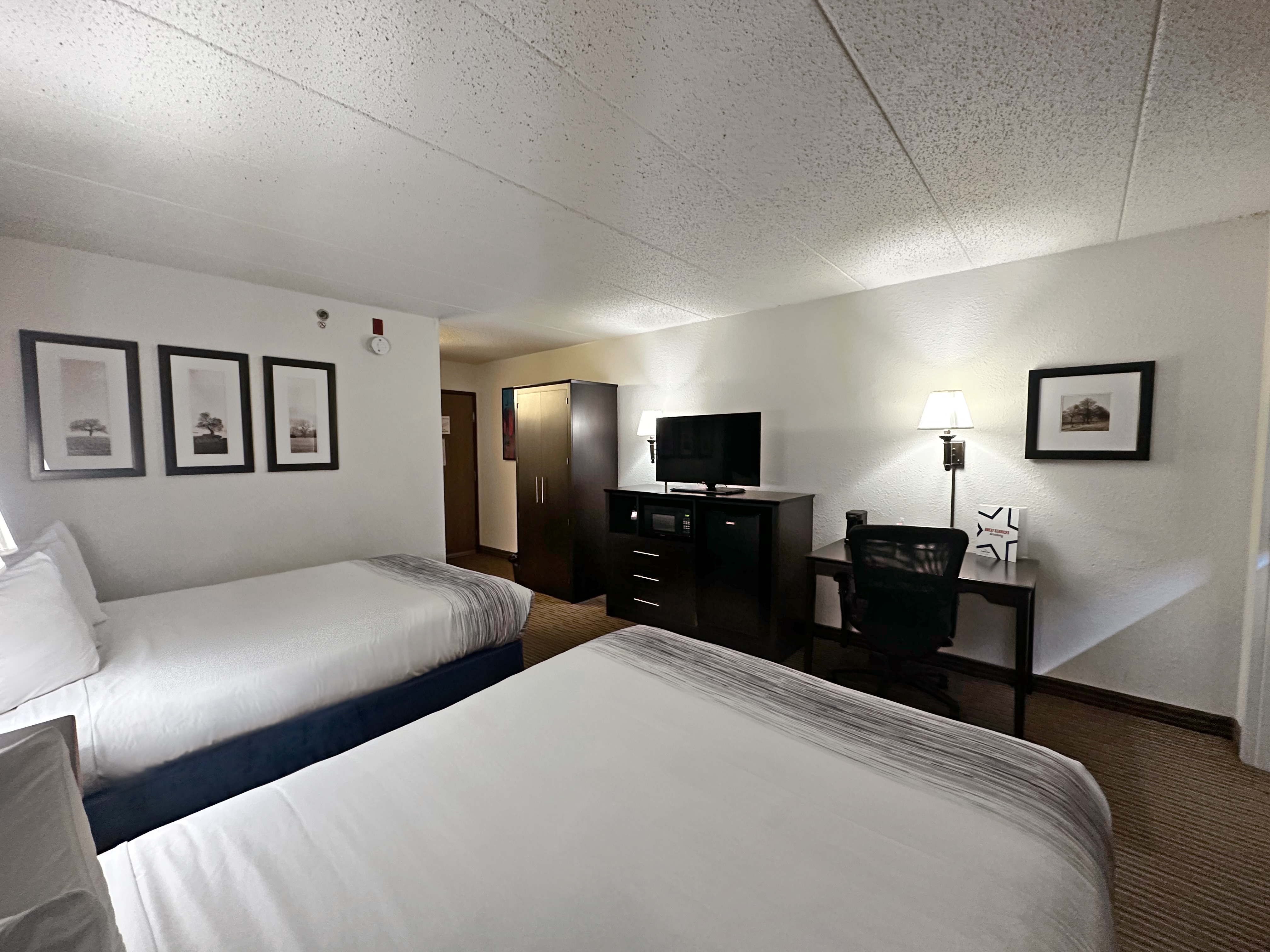 Guest room at the AmericInn by Wyndham Menominee in Menominee, Michigan