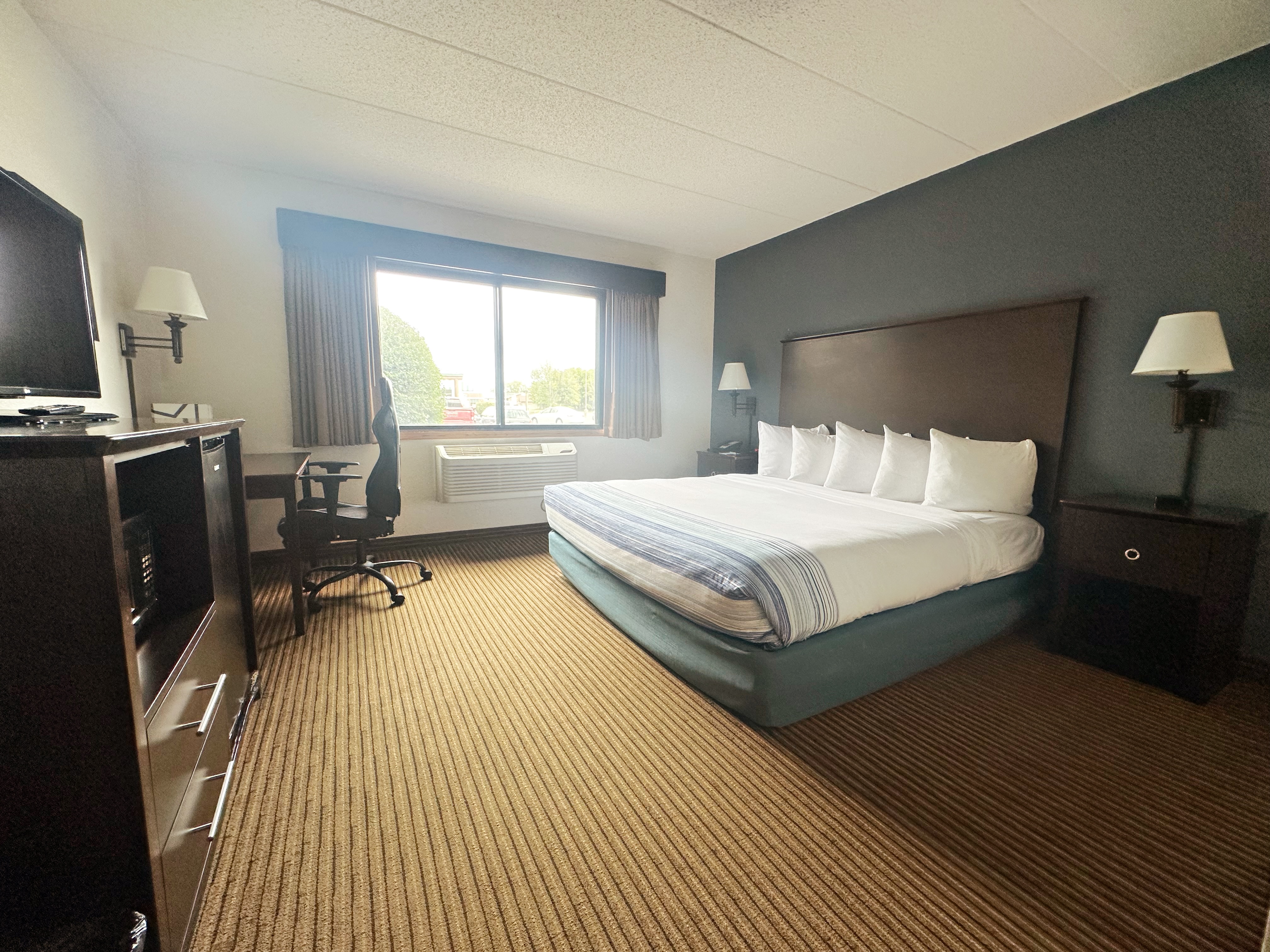Guest room at the AmericInn by Wyndham Menominee in Menominee, Michigan
