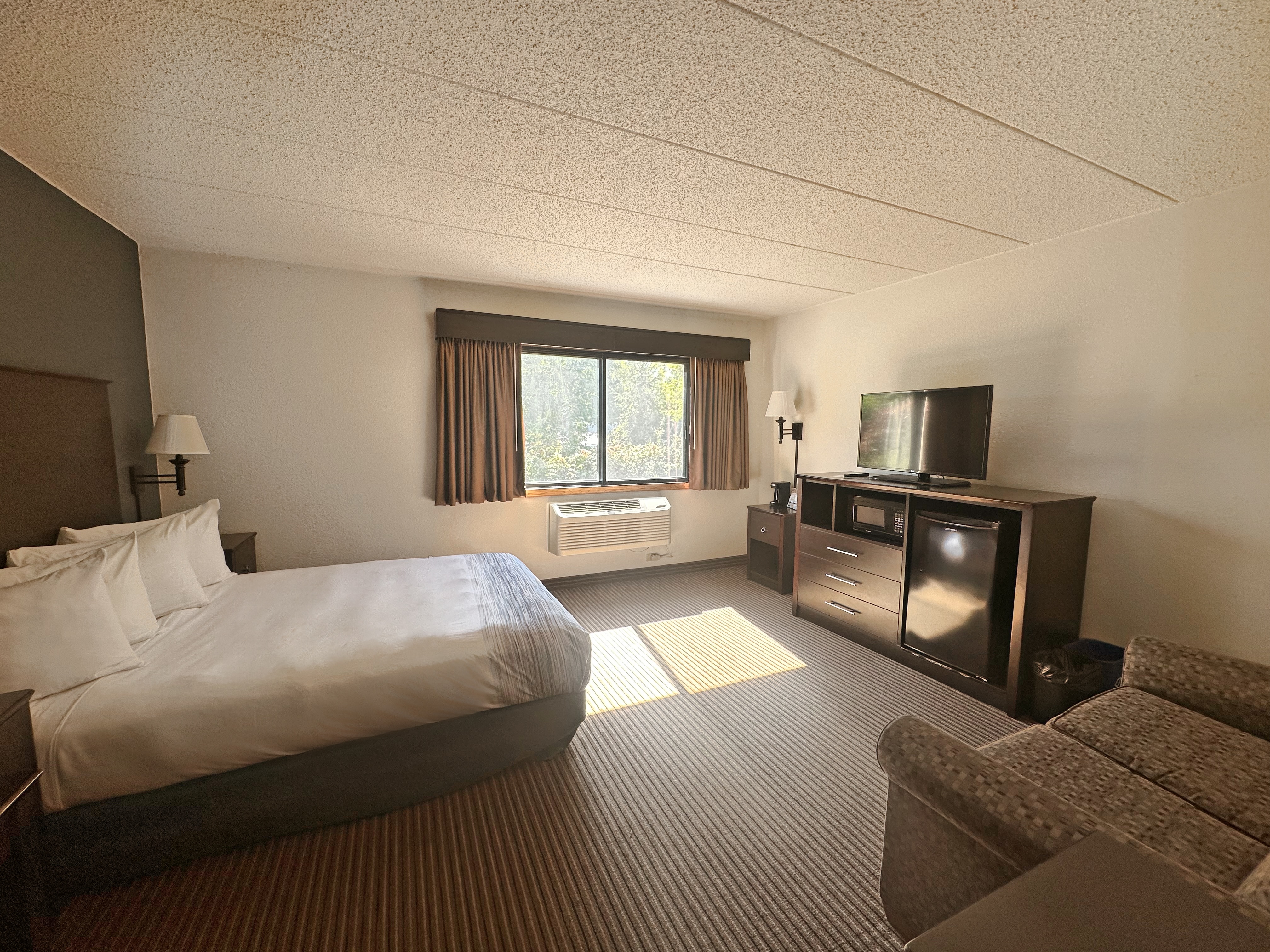Guest room at the AmericInn by Wyndham Menominee in Menominee, Michigan