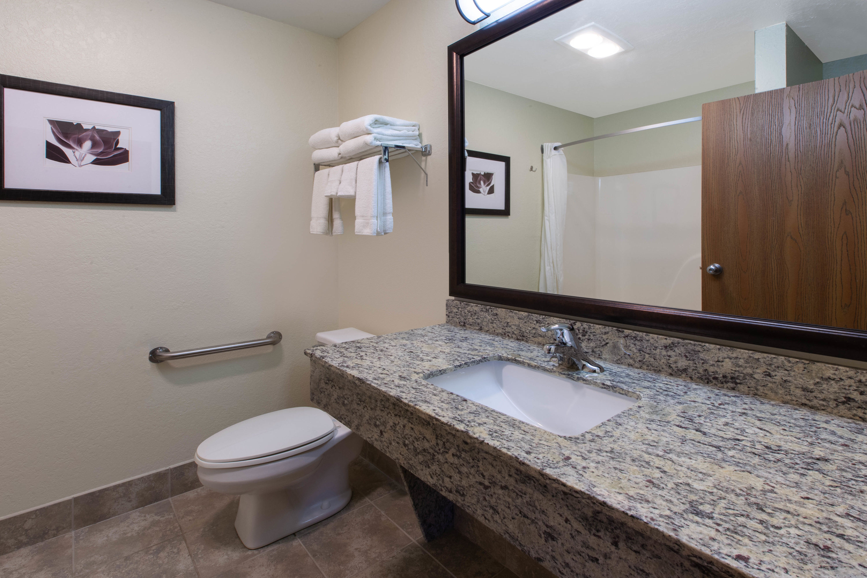 Guest room bath at the AmericInn by Wyndham Petoskey in Petoskey, Michigan