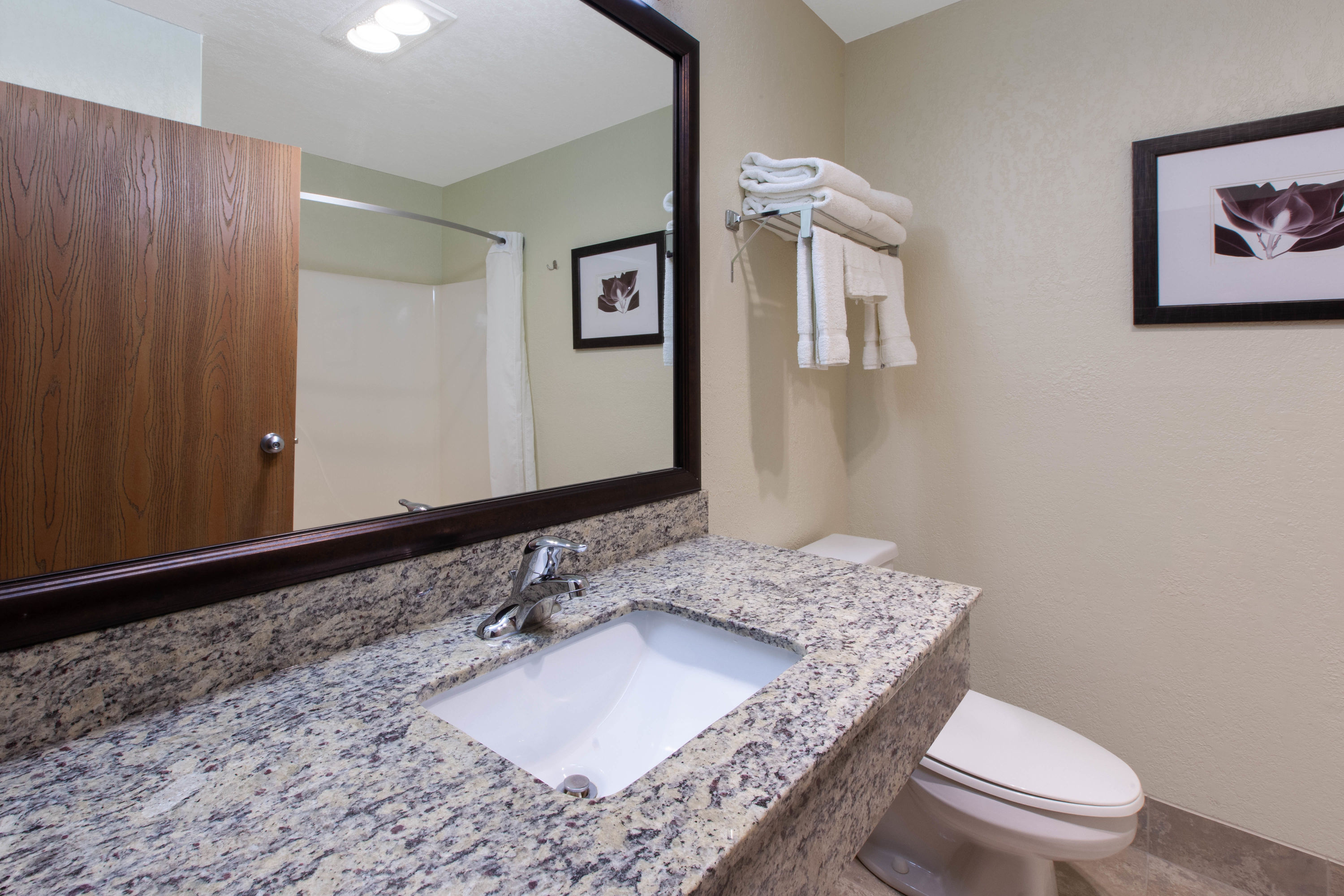 Guest room bath at the AmericInn by Wyndham Petoskey in Petoskey, Michigan