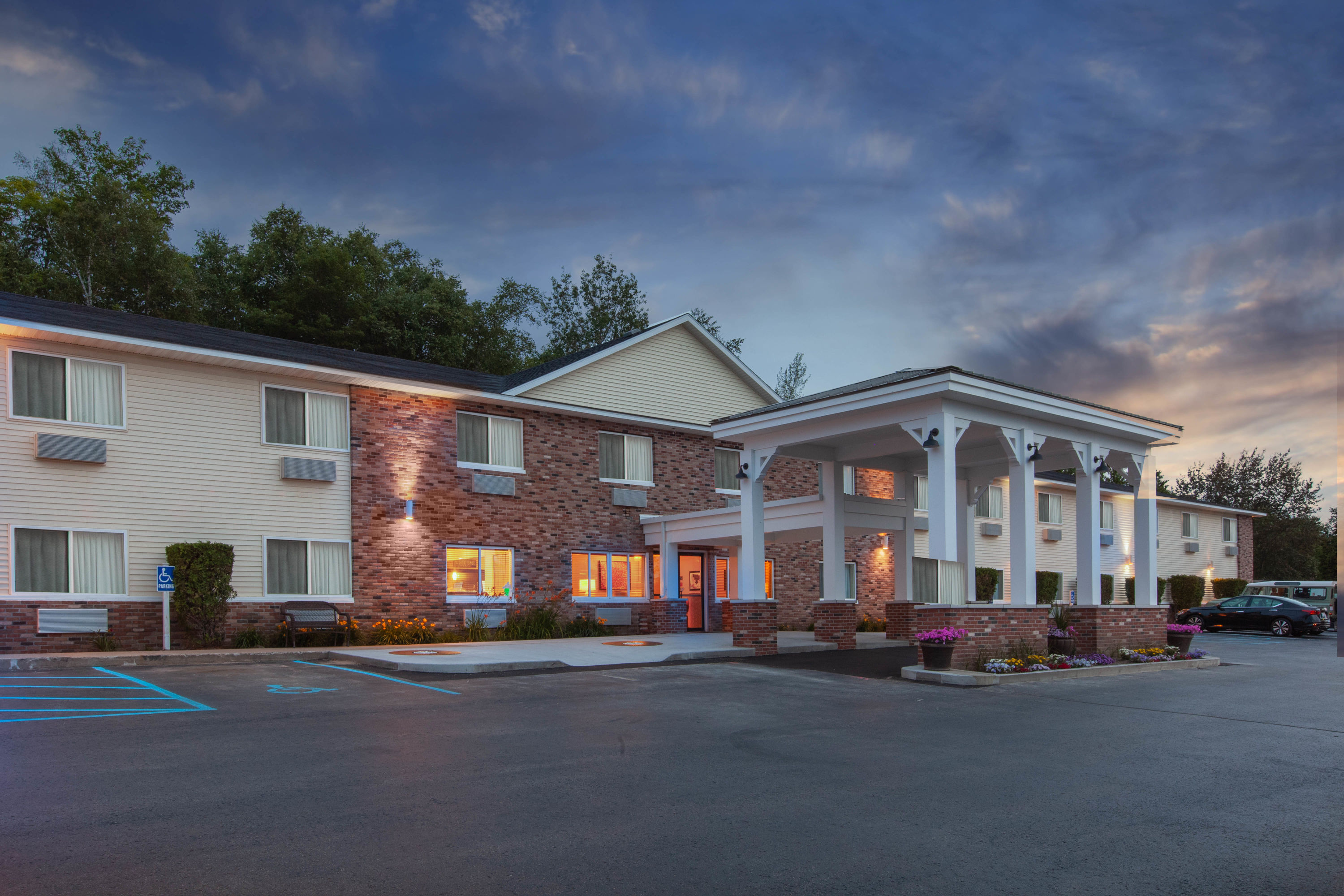 Exterior Dusk Image of AmericInn by Wyndham Petoskey hotel in Petoskey, Michigan