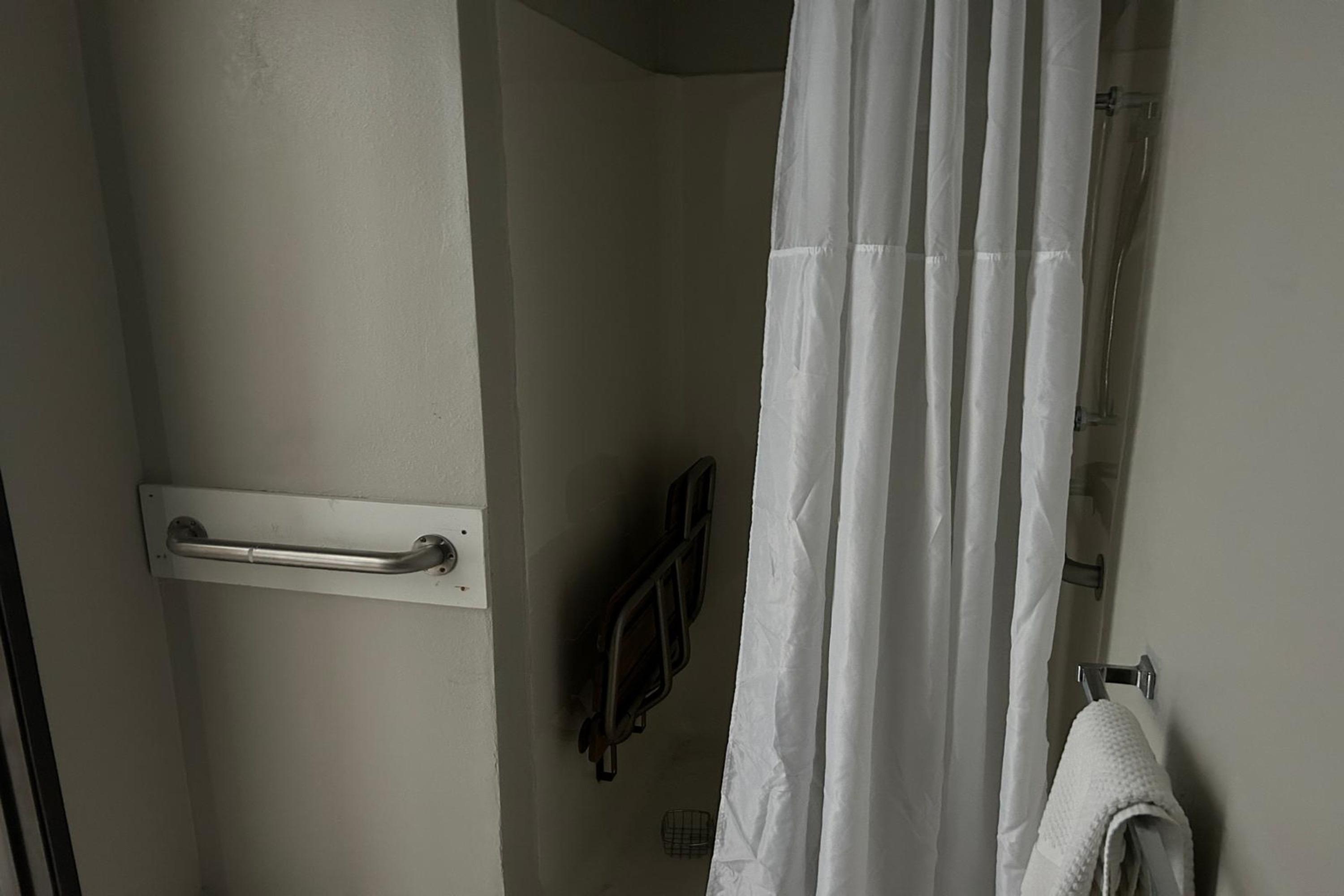 Guest room bath at the AmericInn by Wyndham Saint Ignace in Saint Ignace, Michigan